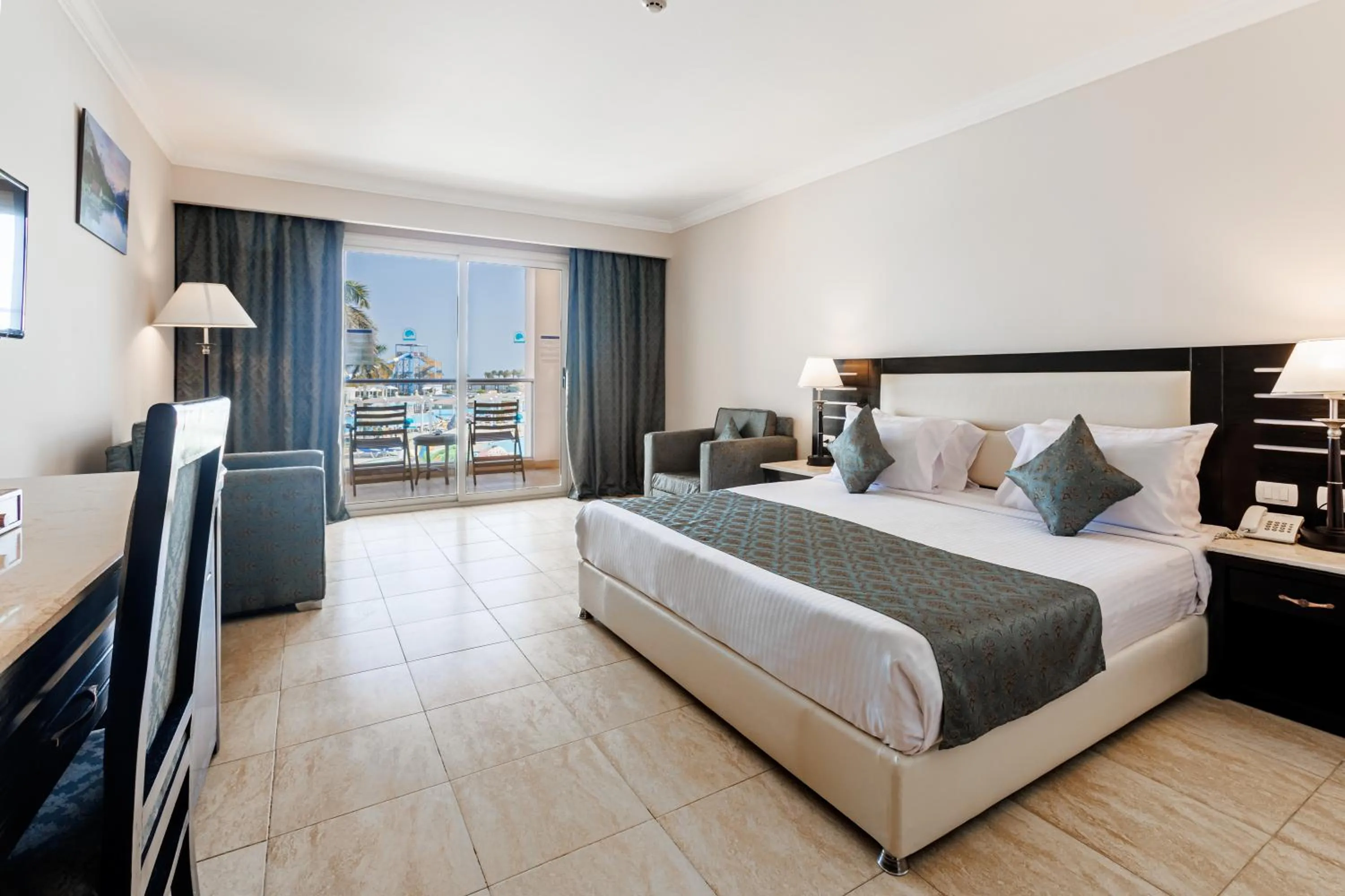 Bed in Sunrise Alora Aqua Park Resort