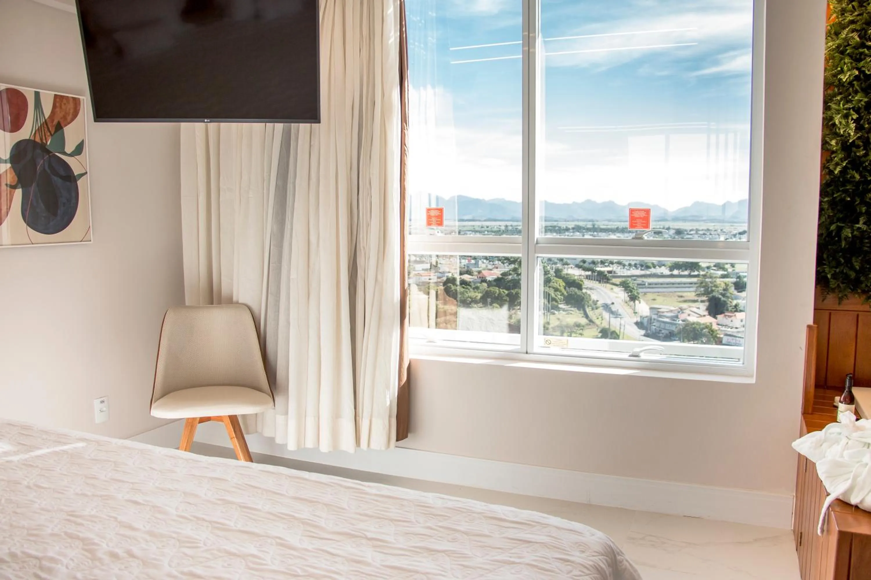 View (from property/room), Bed in Ramada Hotel & Suites Campos Pelinca