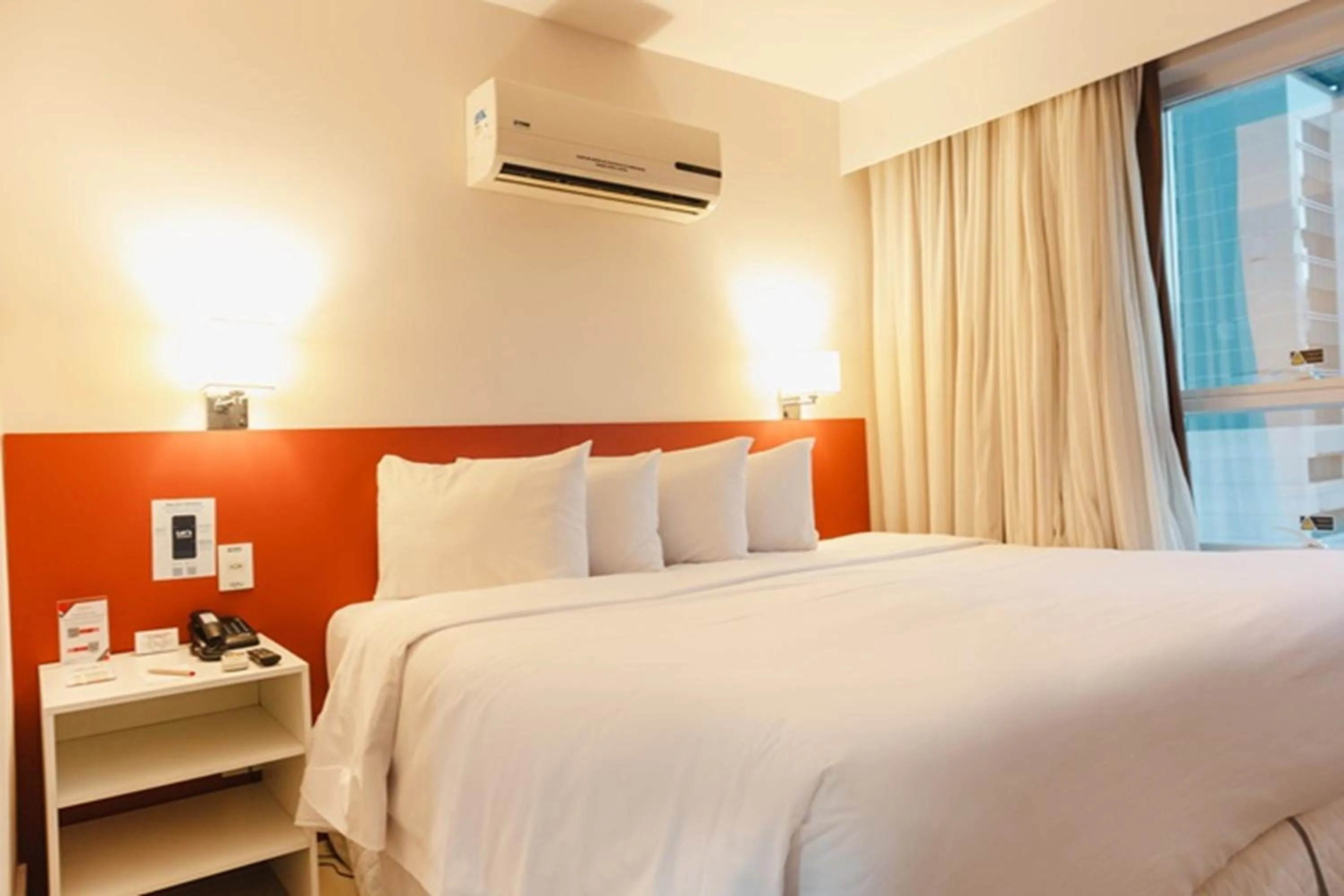 Bedroom, Bed in Ramada Hotel & Suites Campos Pelinca