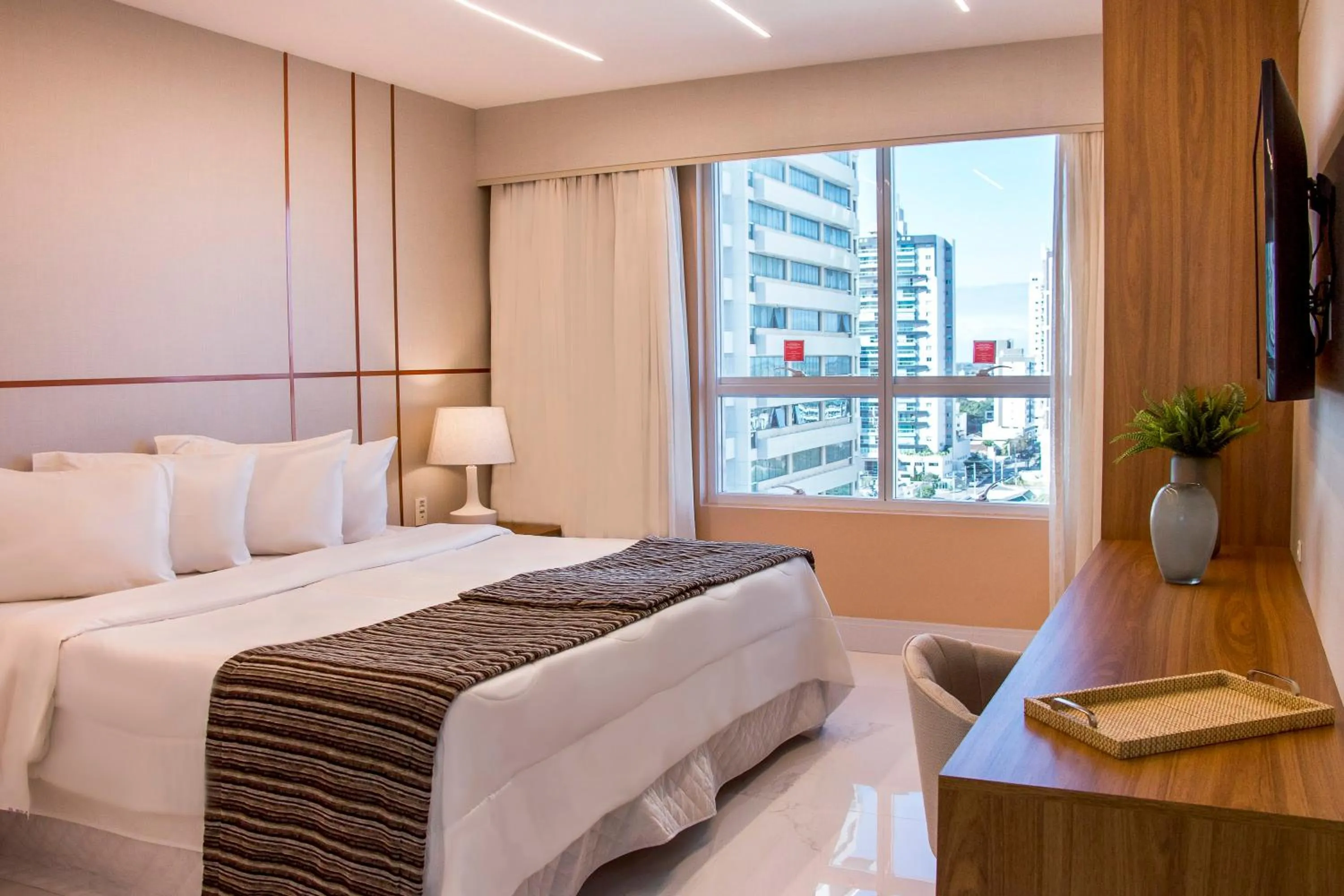 Photo of the whole room, Bed in Ramada Hotel & Suites Campos Pelinca