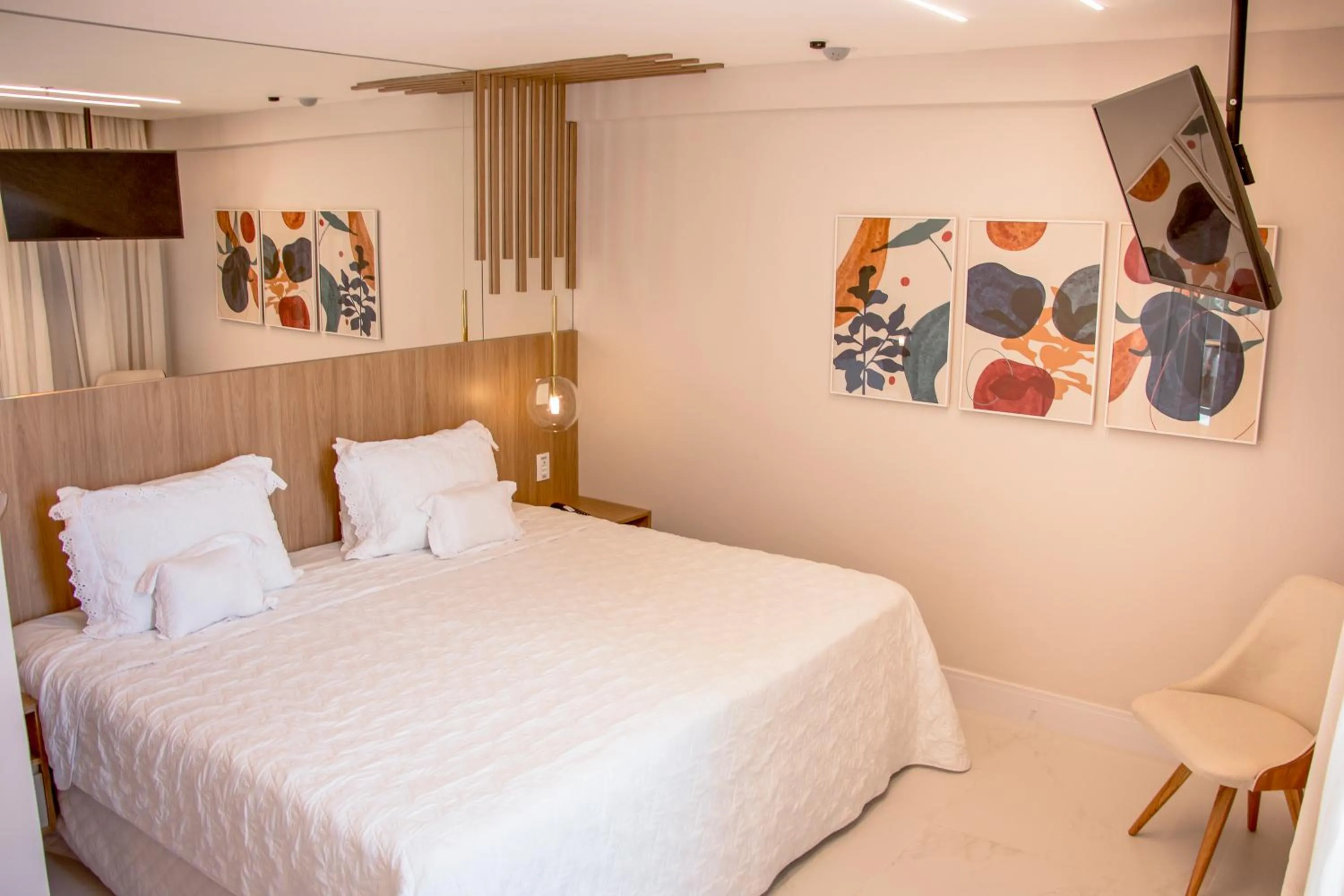Bed in Ramada Hotel & Suites Campos Pelinca