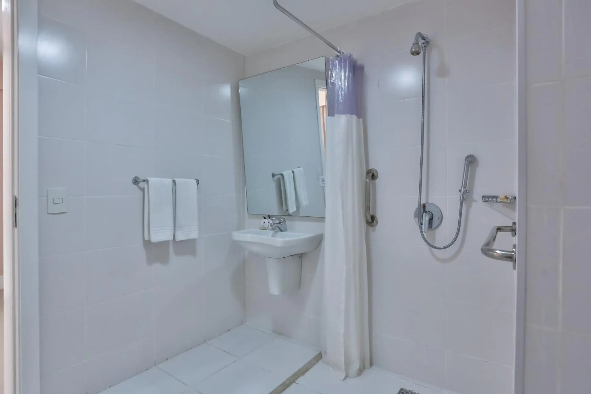 Bathroom in Ramada Hotel & Suites Campos Pelinca