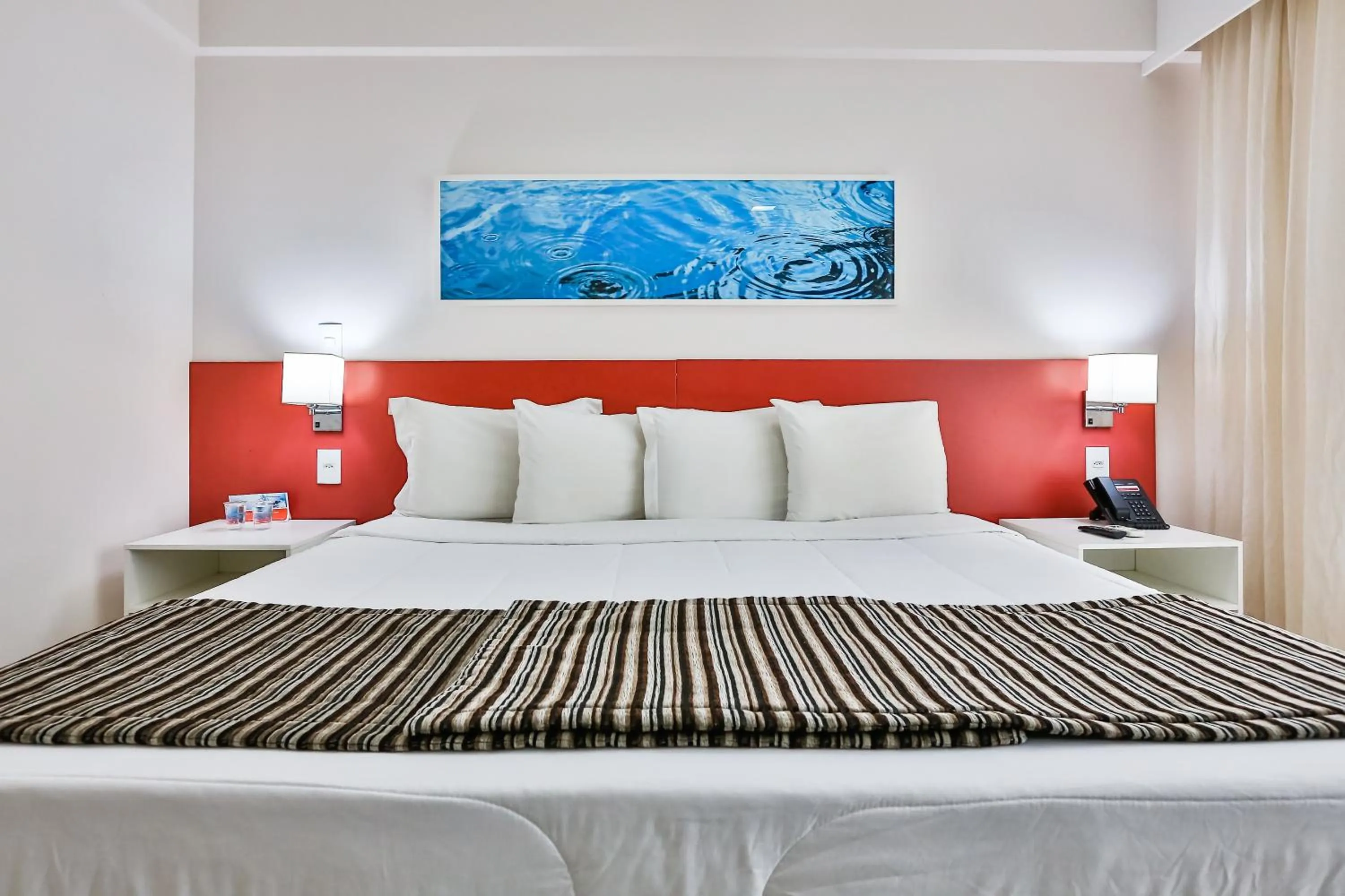 Bed in Ramada Hotel & Suites Campos Pelinca