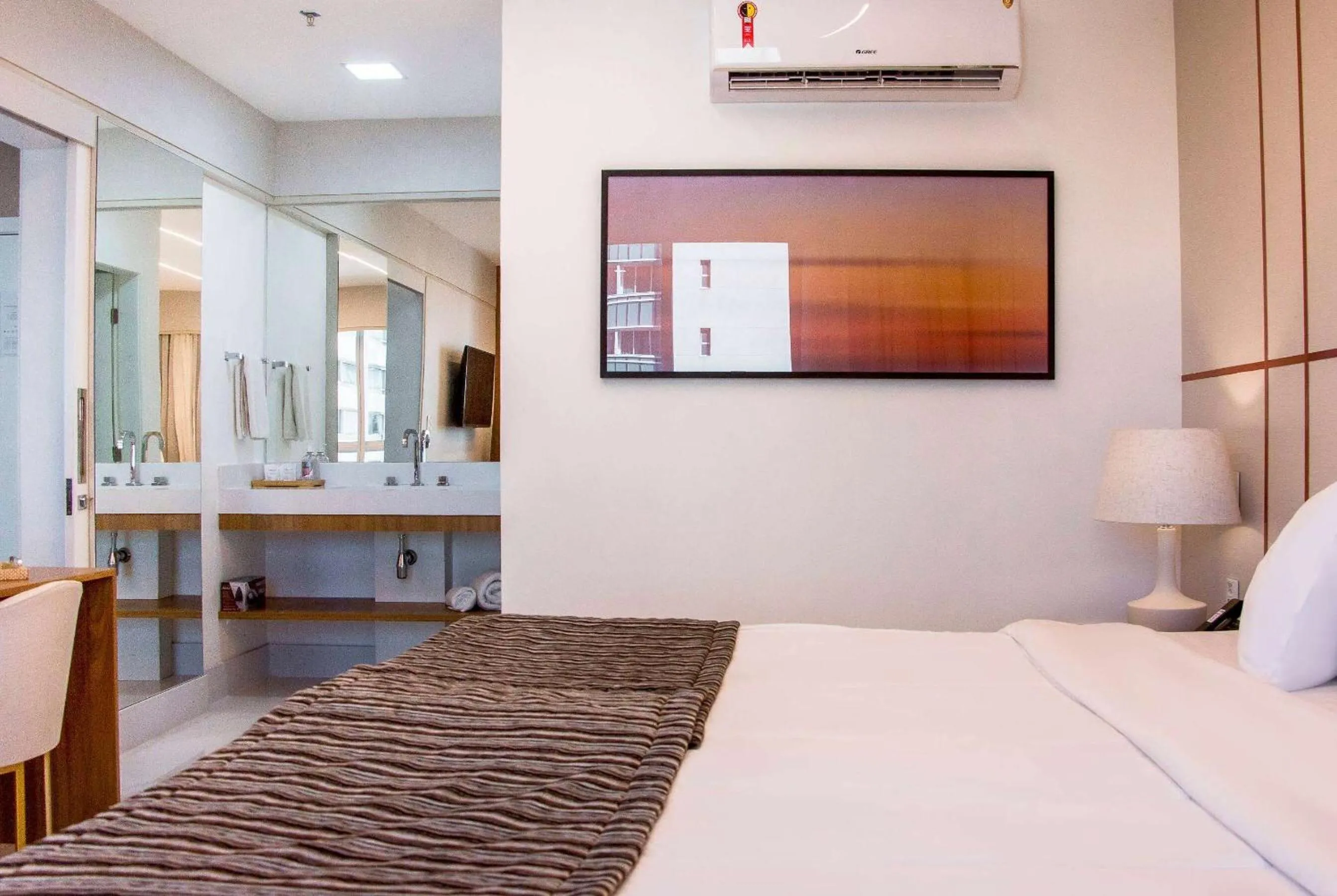 Bed in Ramada Hotel & Suites Campos Pelinca