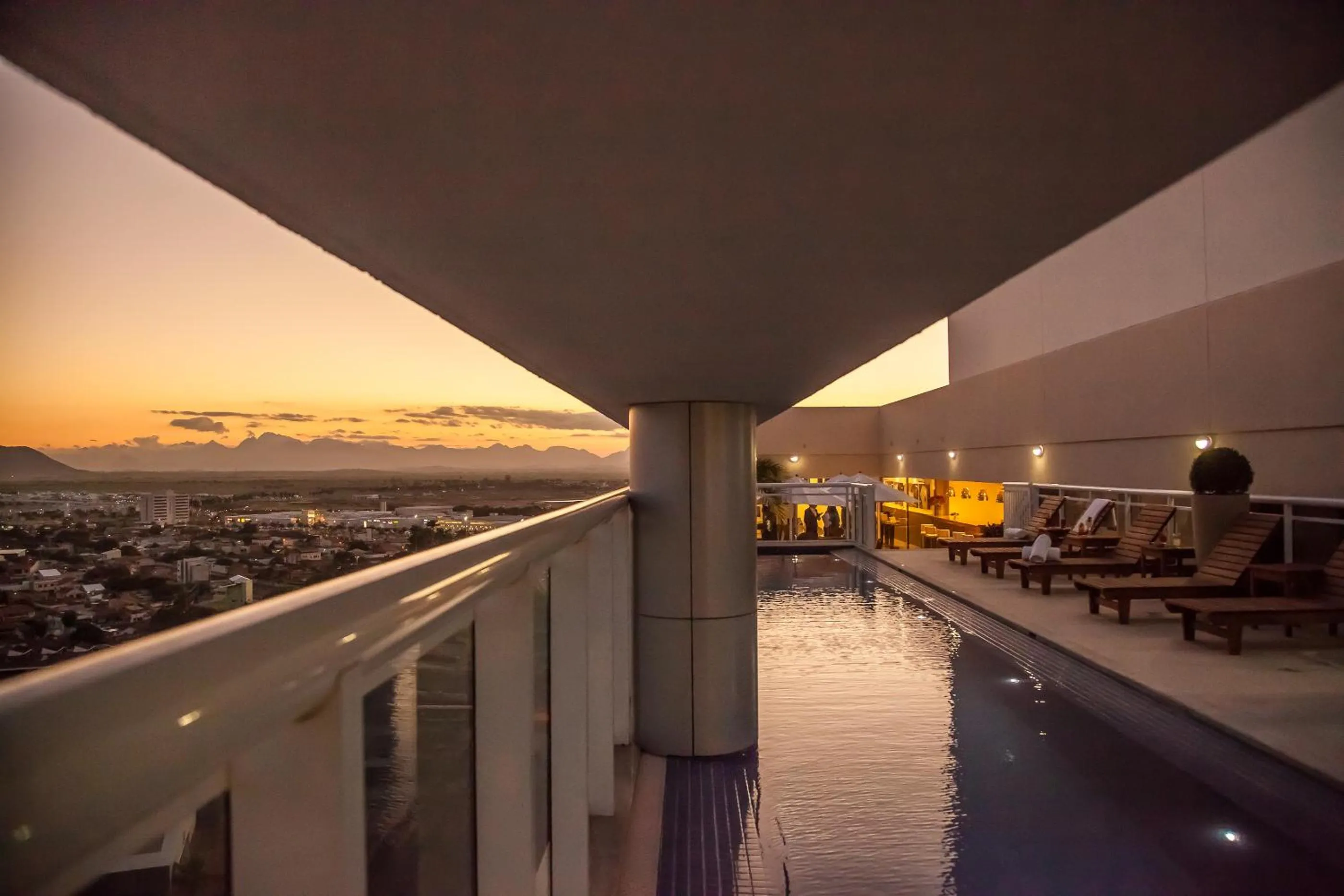 Swimming pool in Ramada Hotel & Suites Campos Pelinca