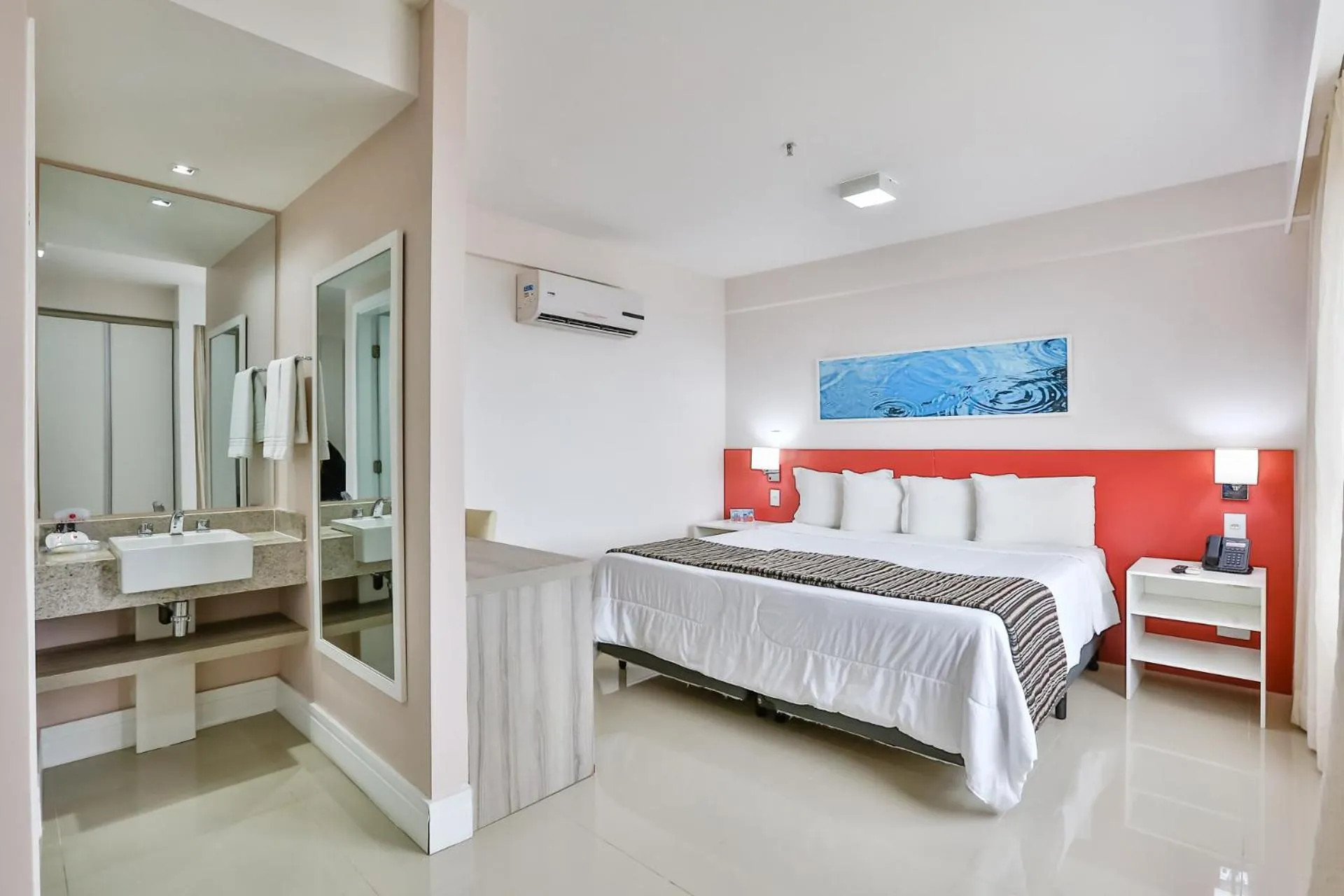 Bed in Ramada Hotel & Suites Campos Pelinca