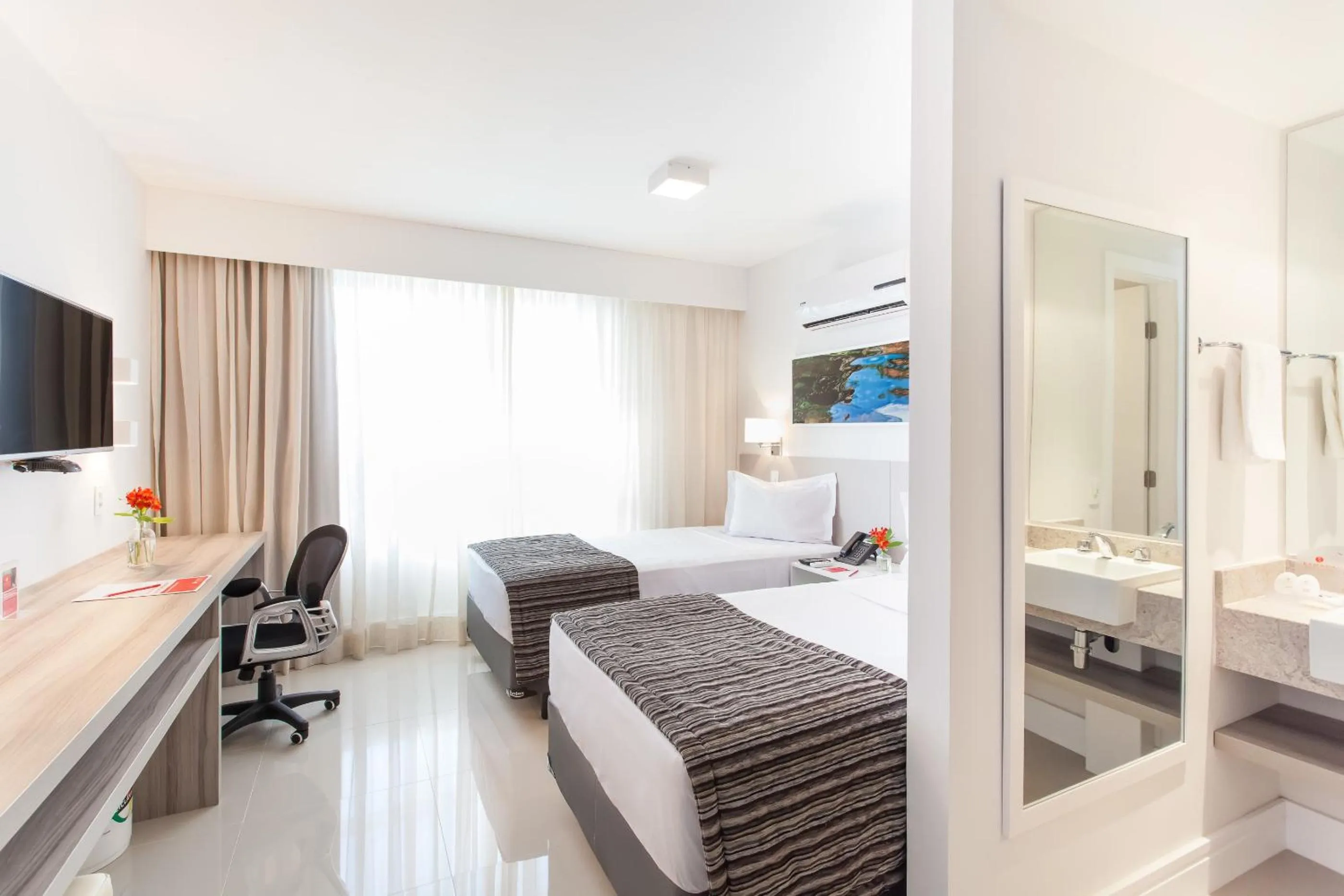 Bed in Ramada Hotel & Suites Campos Pelinca