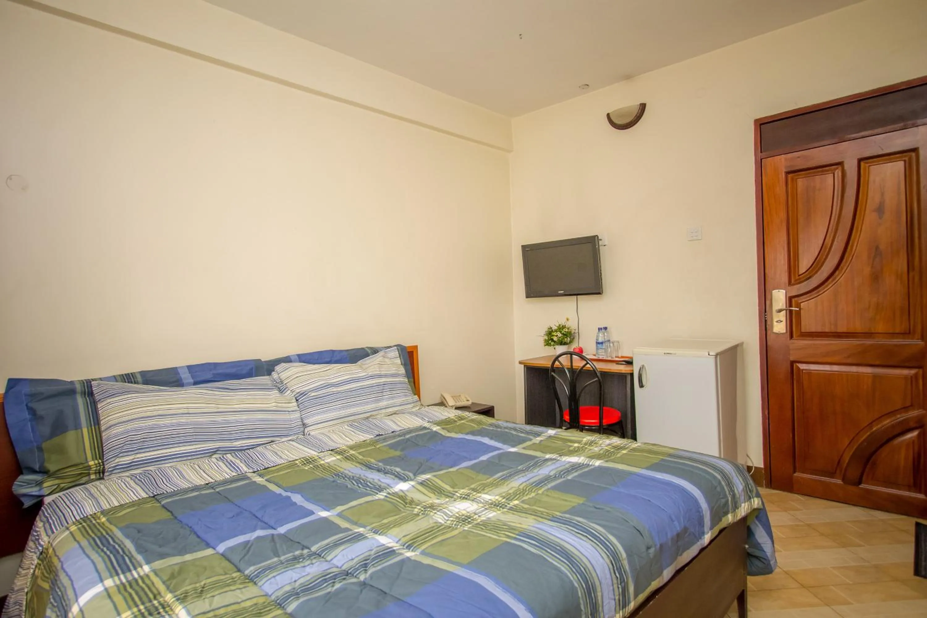 Bed in Grand Global Hotel