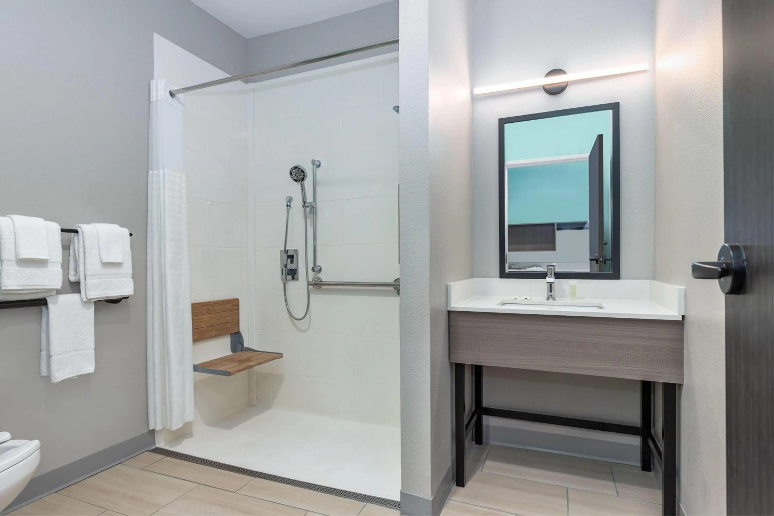 Shower in ECHO Suites Extended Stay by Wyndham Dallas Plano Richardson