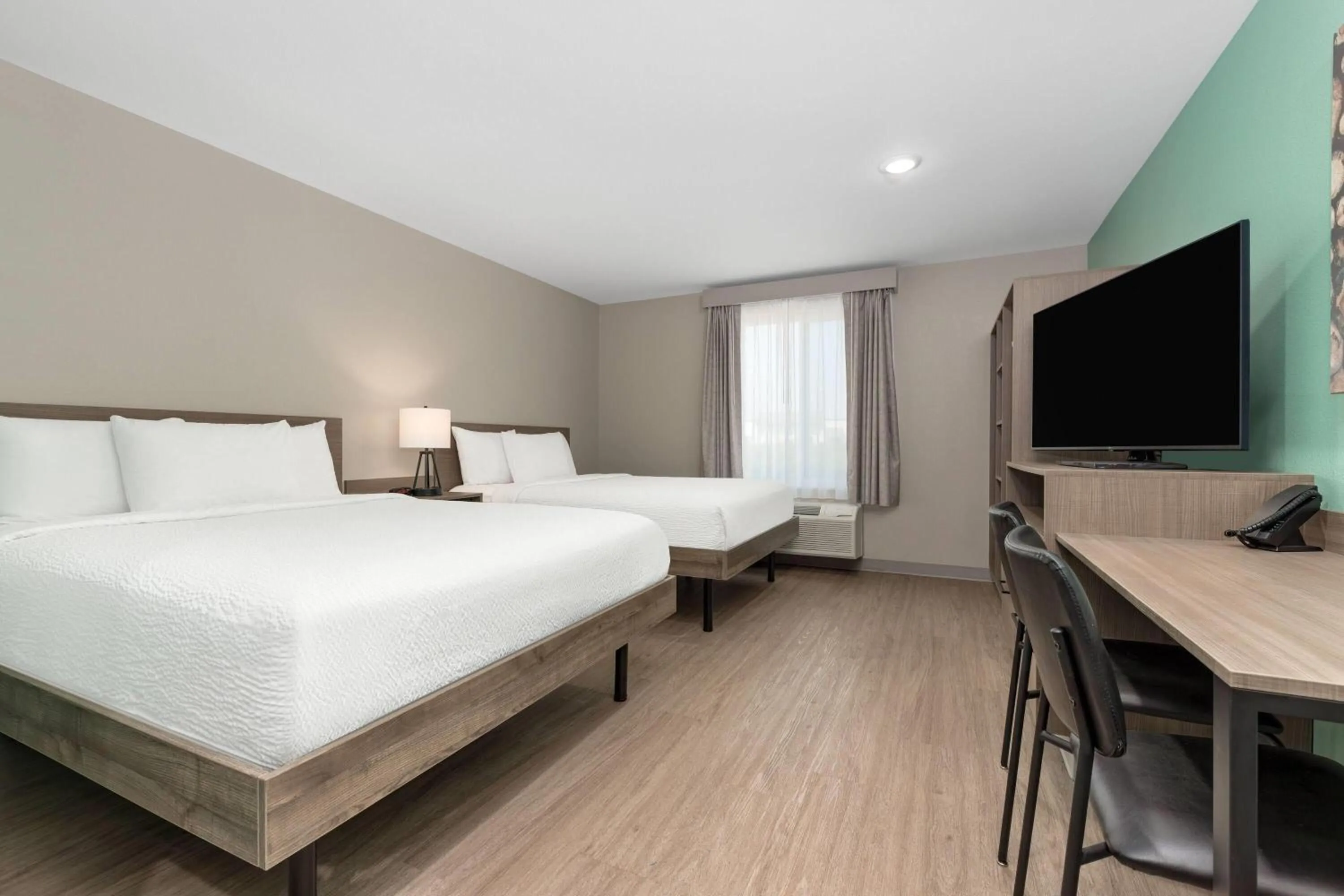 Photo of the whole room, Bed in ECHO Suites Extended Stay by Wyndham Dallas Plano Richardson