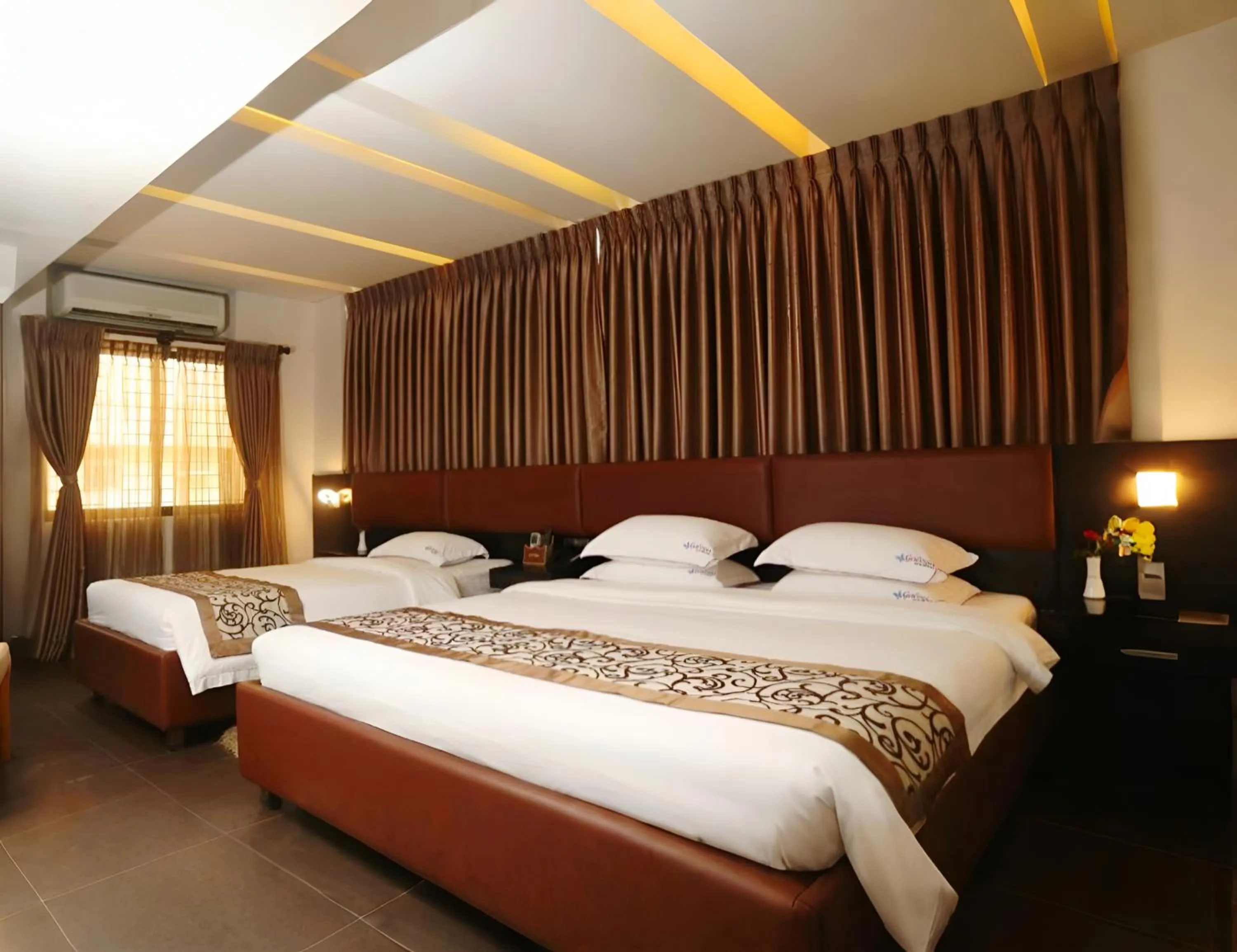 Bed in D'more Dhaka Hotel & Resort