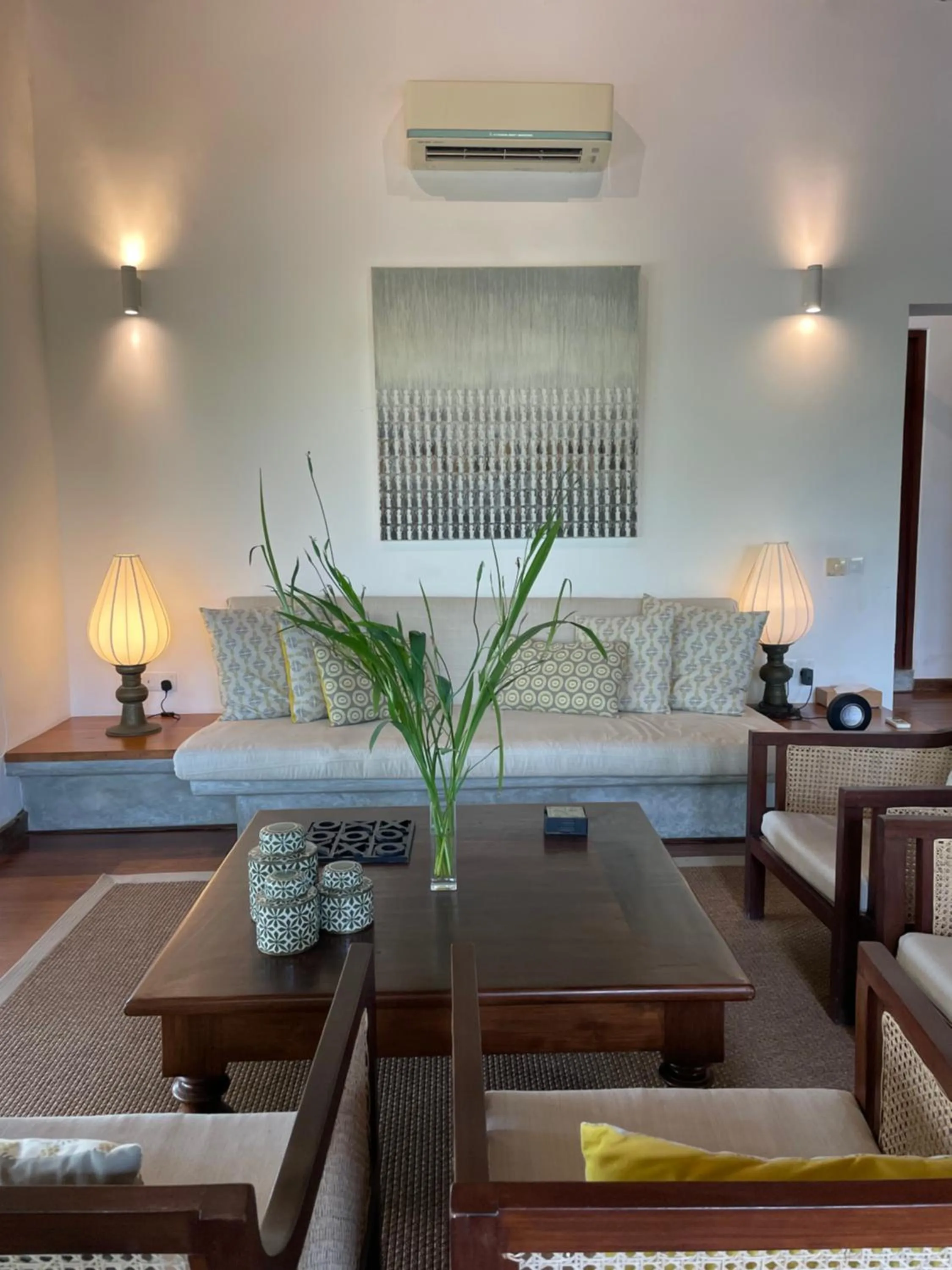 Seating area, Bed in Calamansi Cove Villas