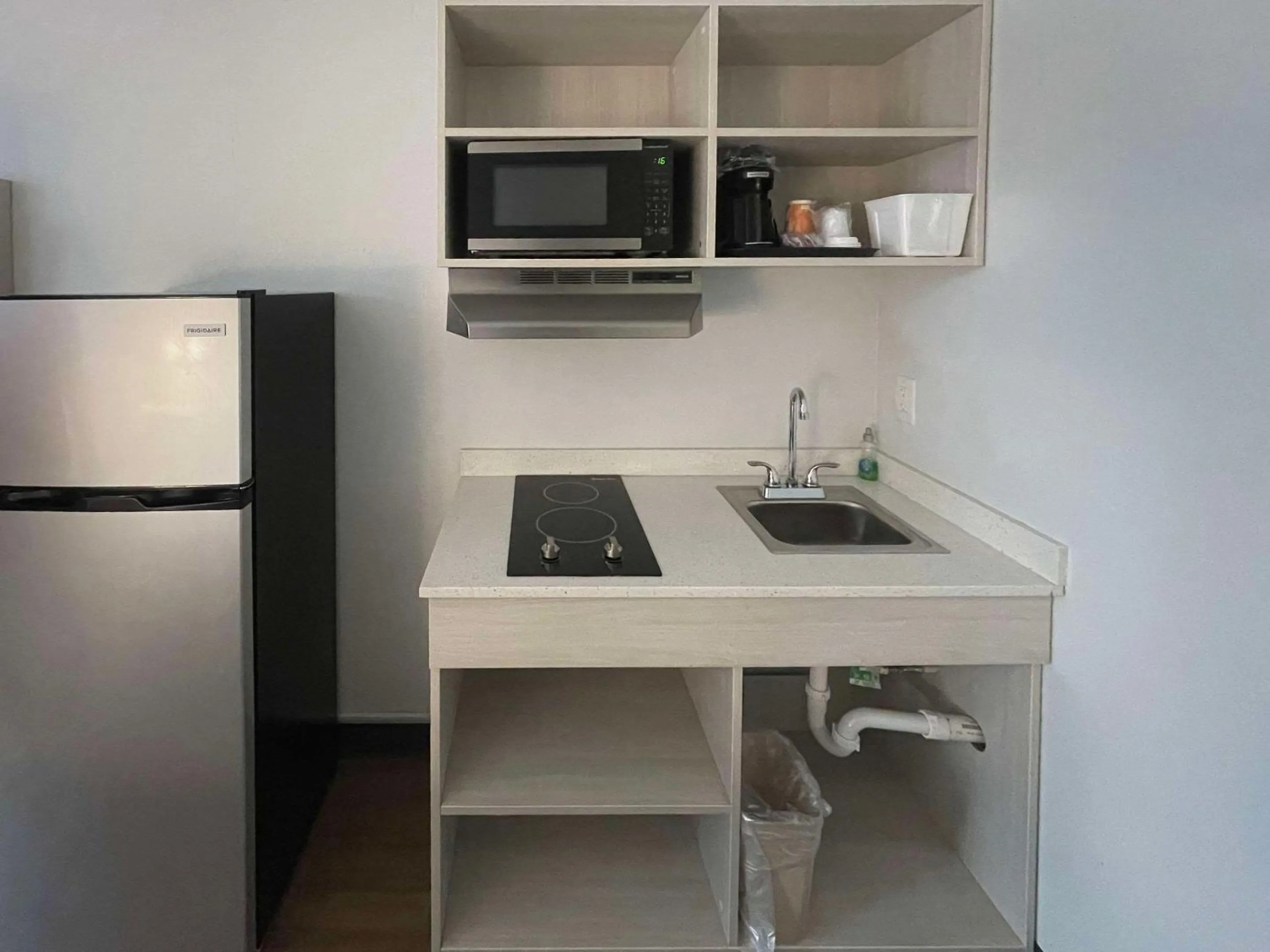 Kitchen or kitchenette in Suburban Studios East Syracuse Carrier Circle
