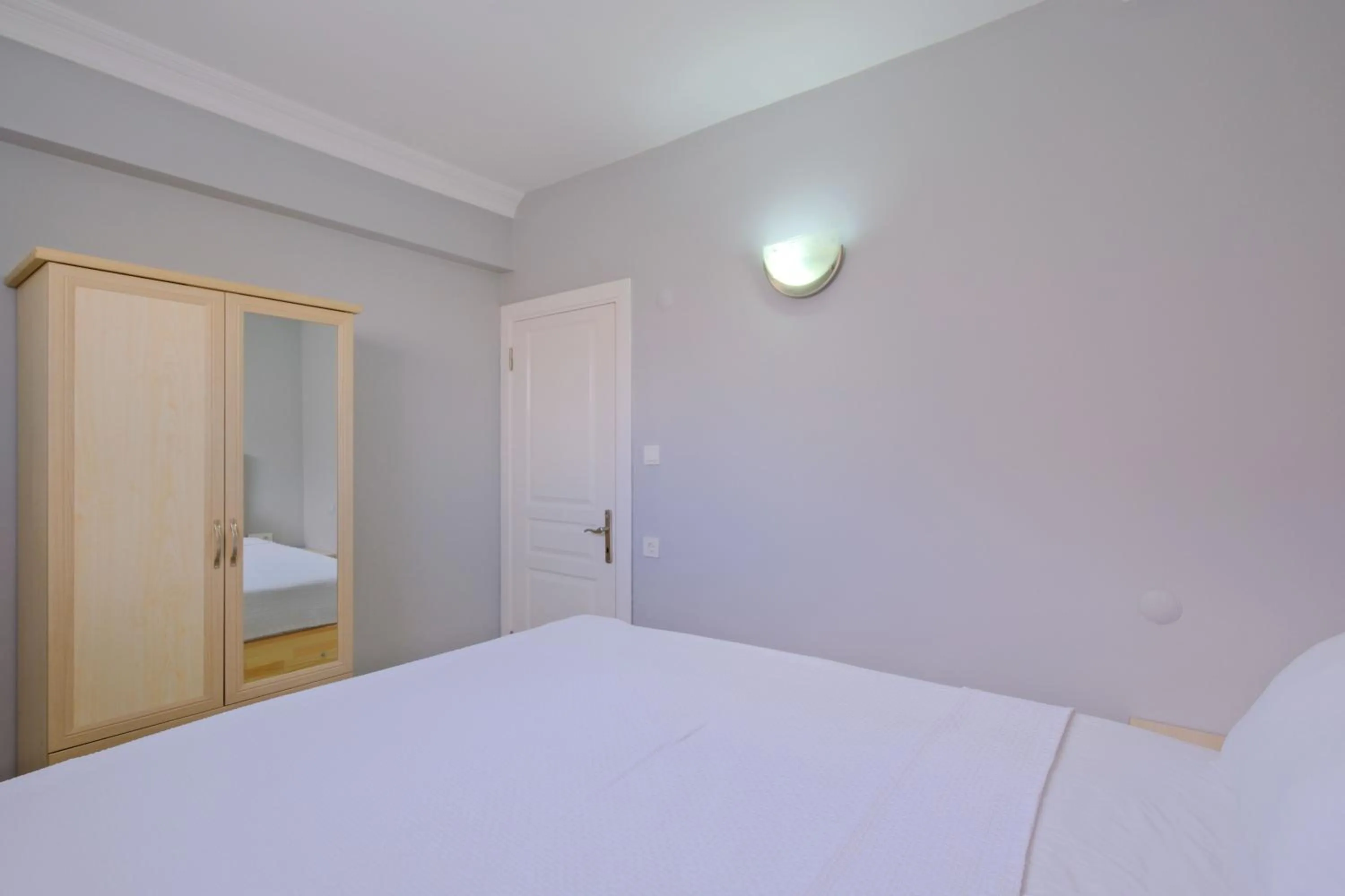 Bed in Gold Lion Apart Hotel