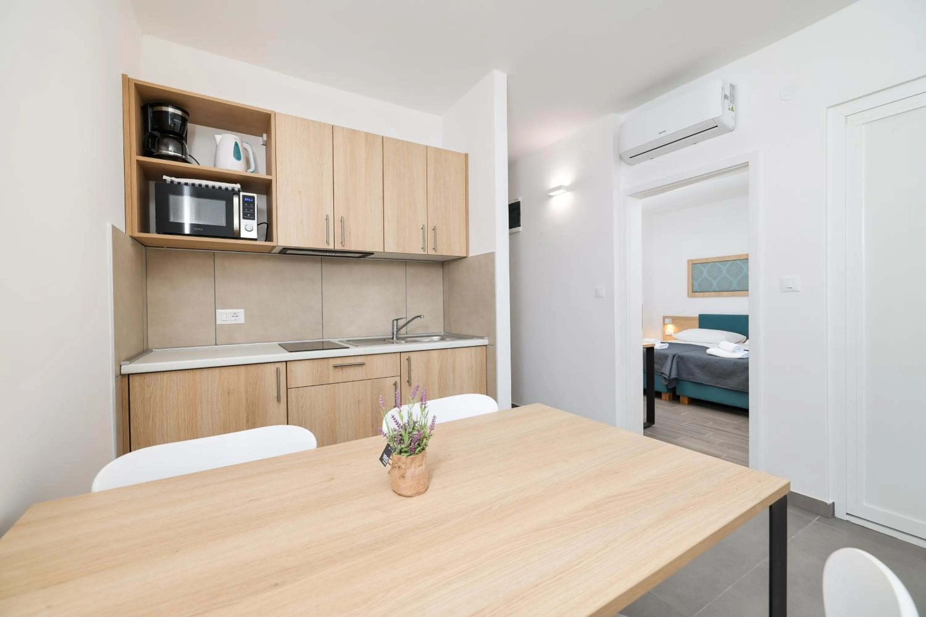 Kitchen or kitchenette, Bed in Apartments Medena