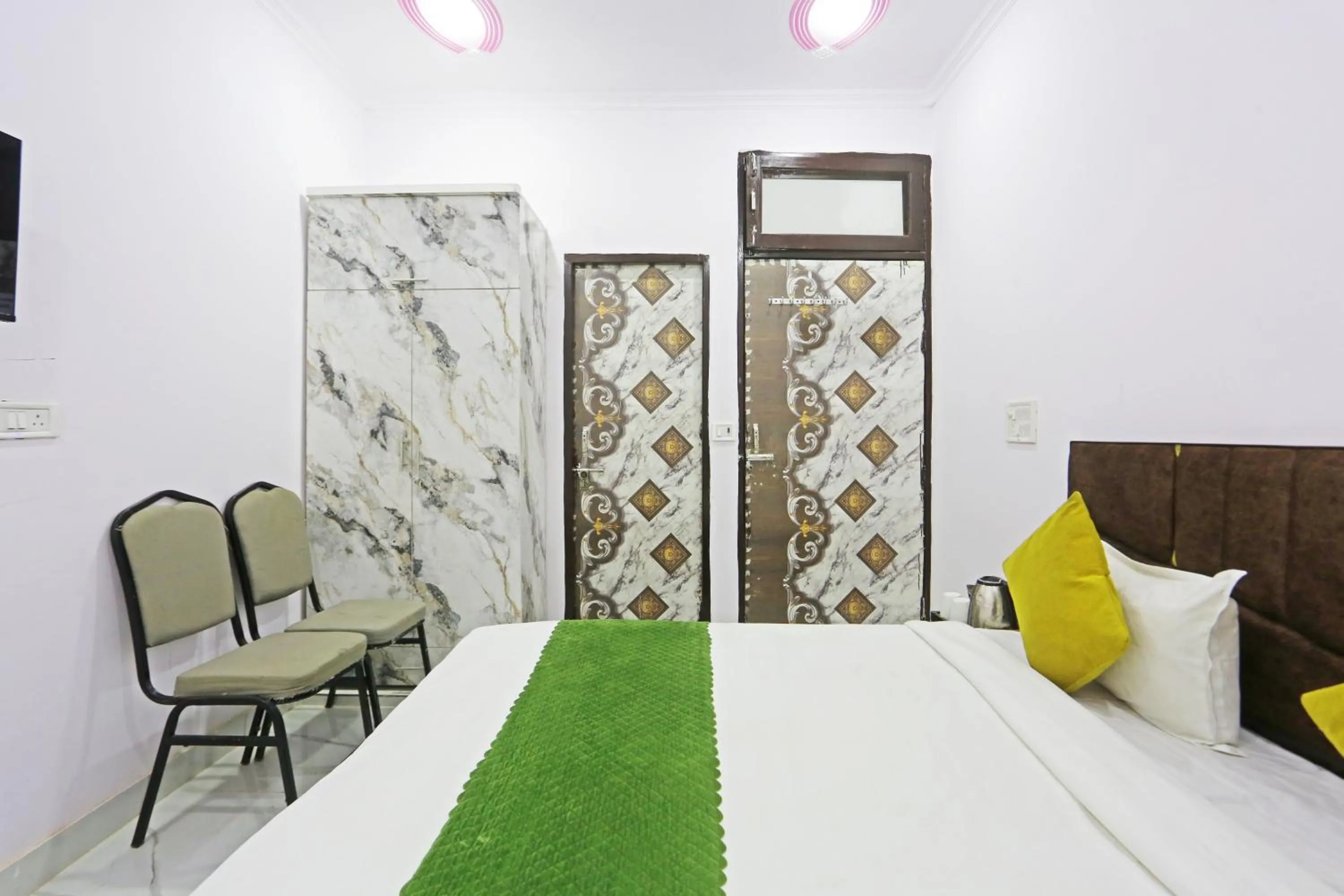 Bed in Twamev Residency