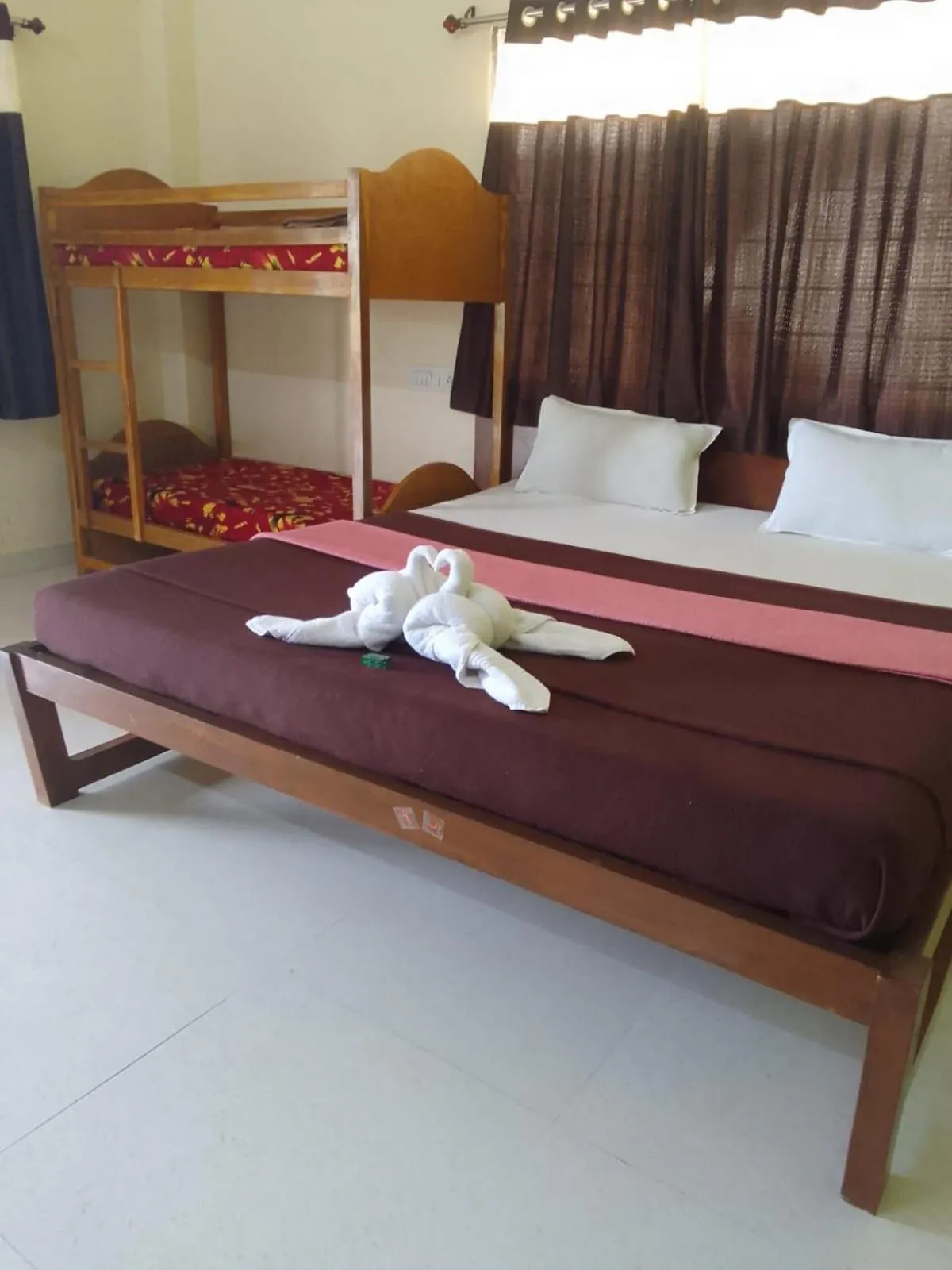 Bed in Madhura Agro Tourism