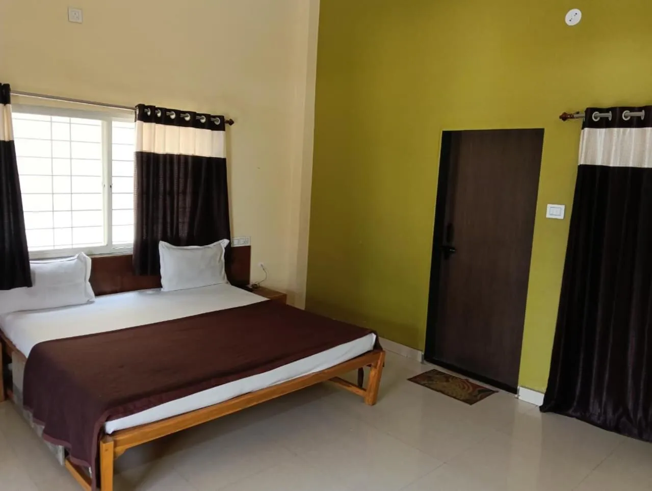 Bed in Madhura Agro Tourism