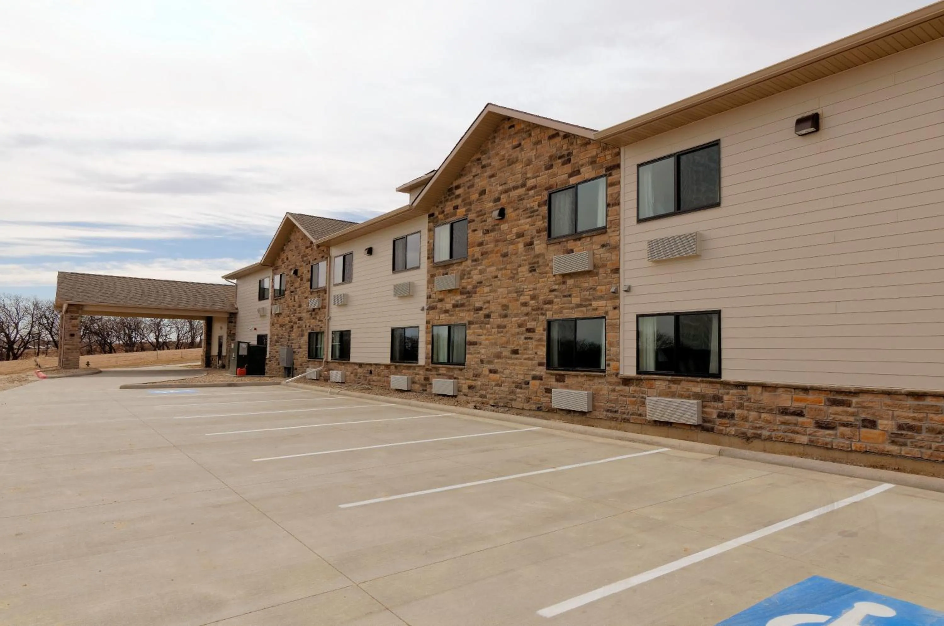 Property building in Cobblestone Inn & Suites - Denison | Oak Ridge
