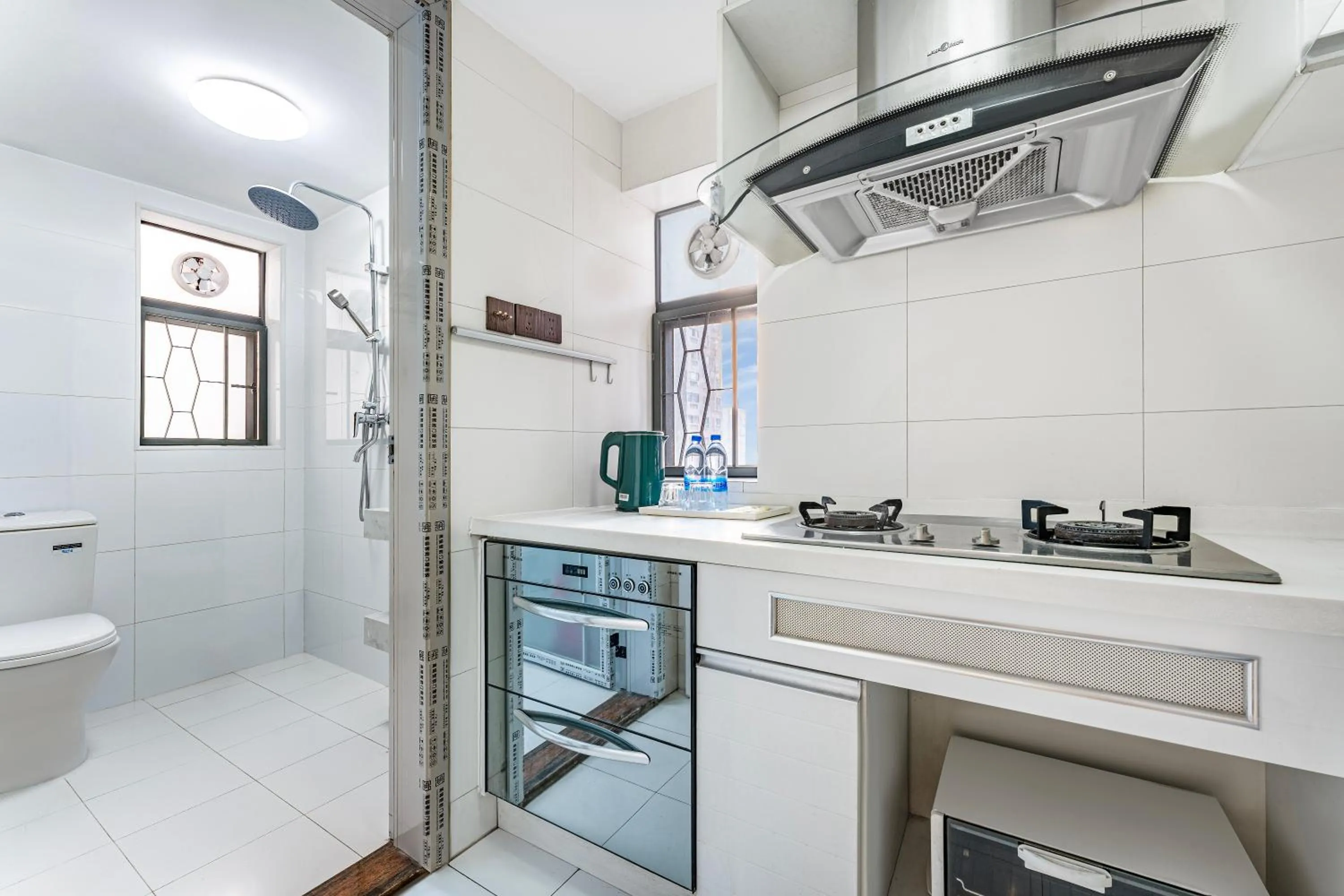 Kitchen or kitchenette in Meiru Apartment Hotel Guangzhou Bolin Apartment