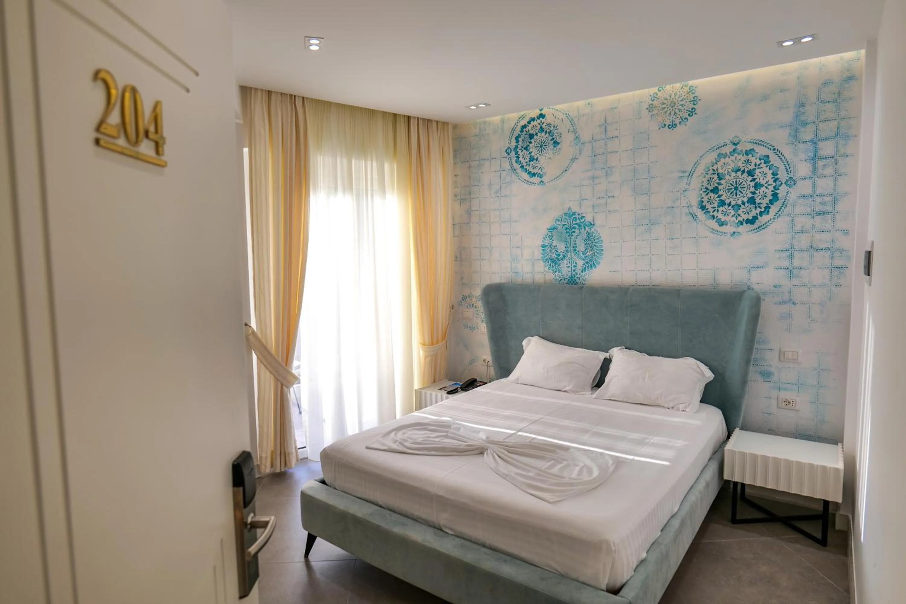 Bed in HH Boutique Hotel