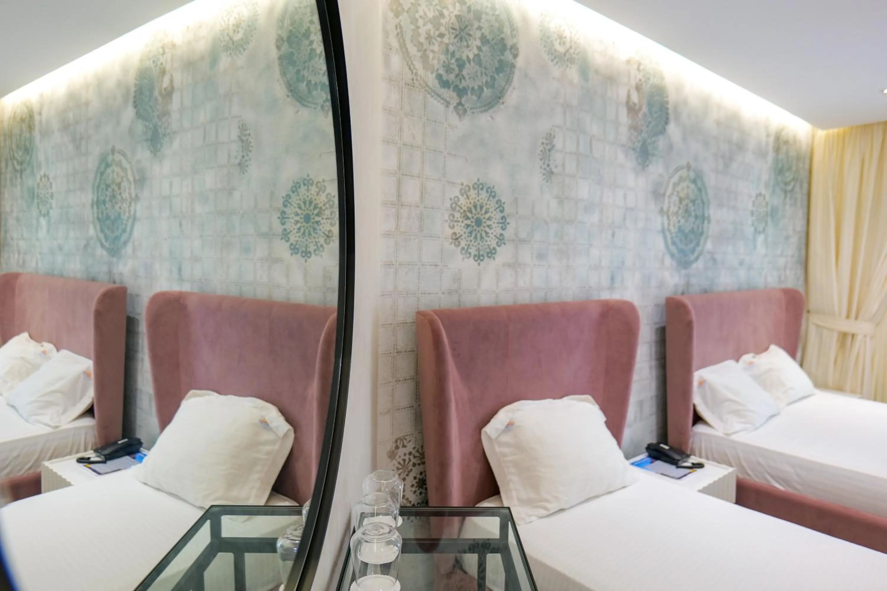 Bed in HH Boutique Hotel