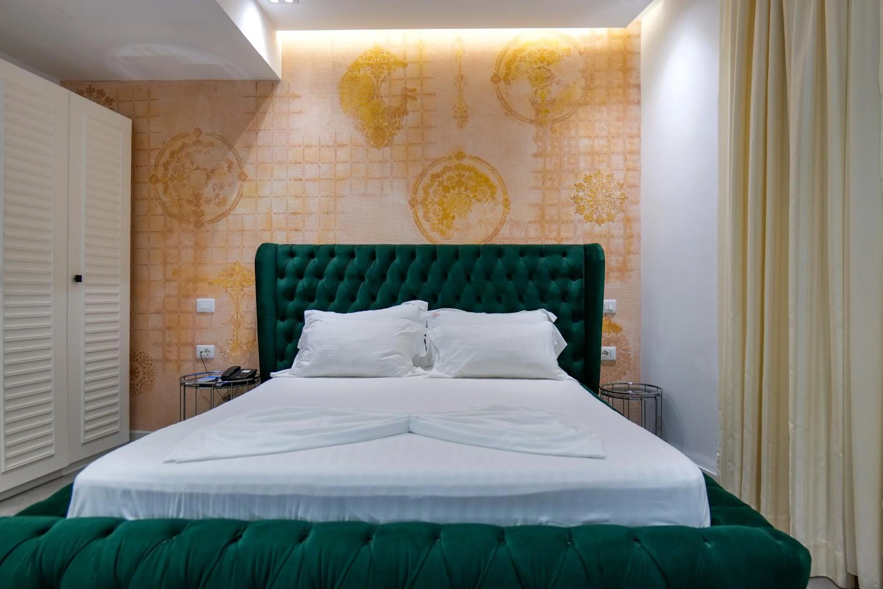 Bed in HH Boutique Hotel