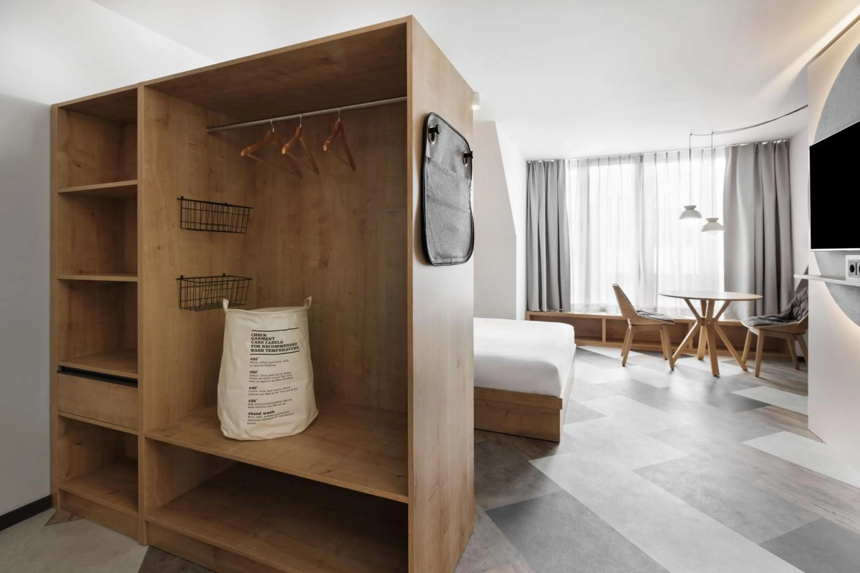 Living room, Bed in Stay KooooK Munich City - NEW OPENING