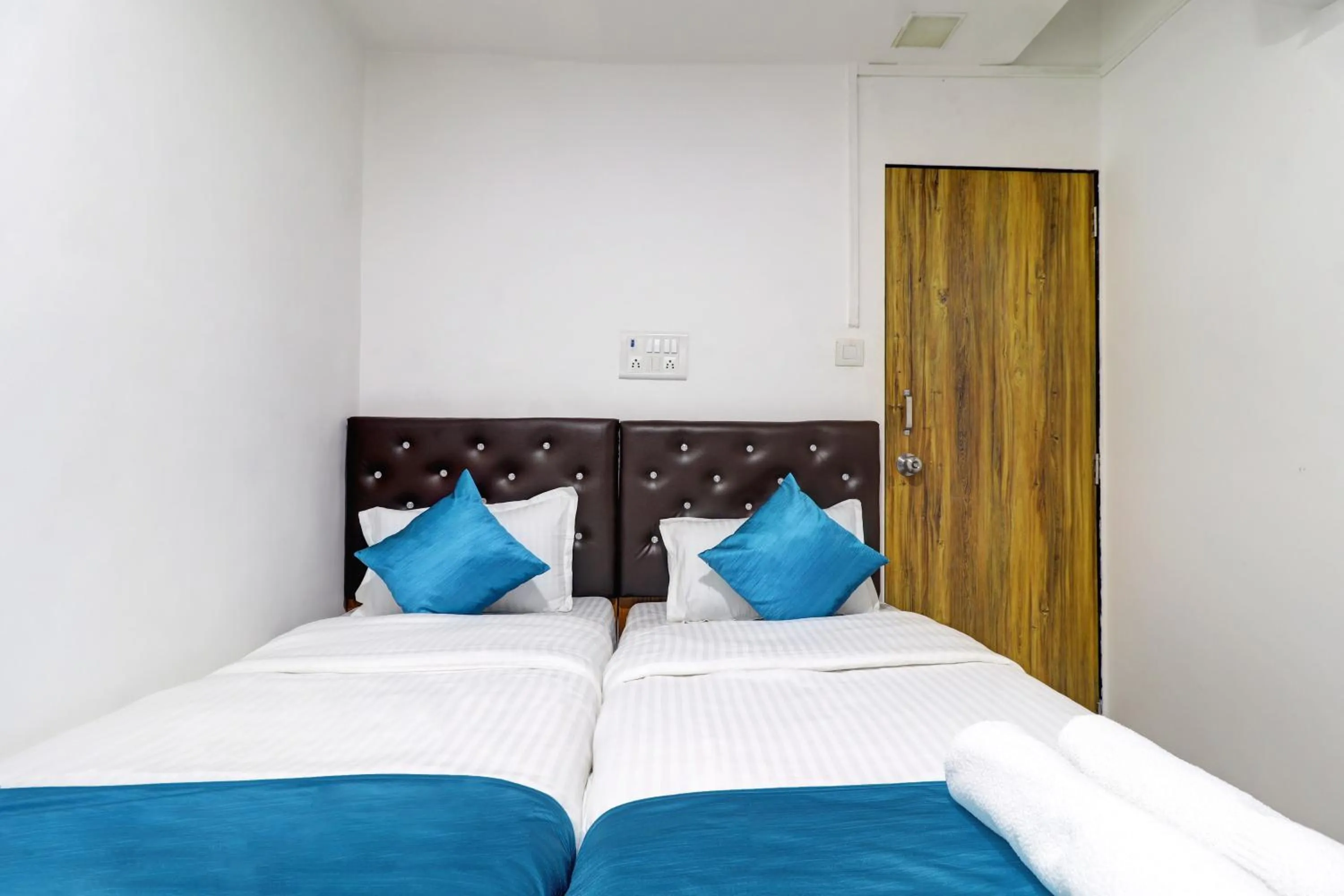 Bed in Raksha Residency