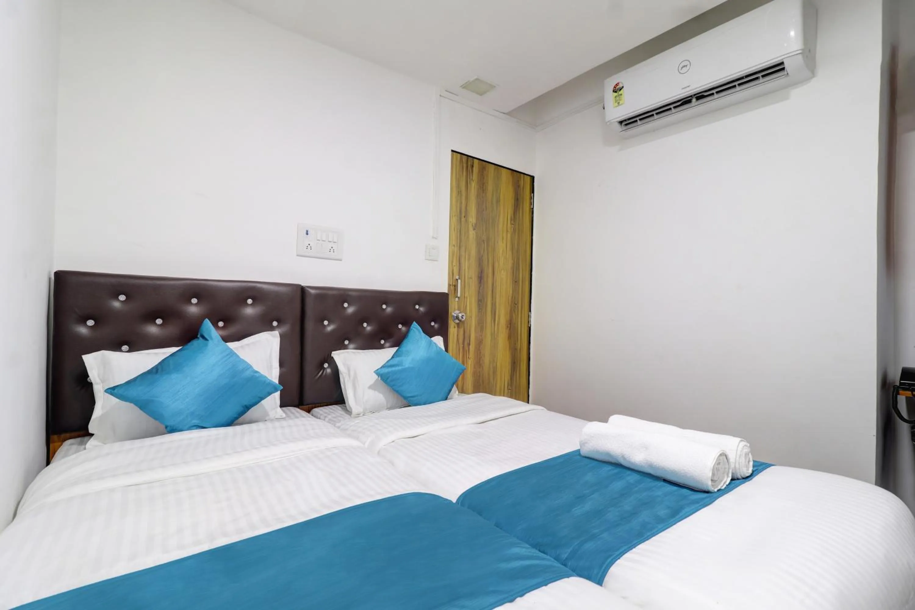 Bed in Raksha Residency