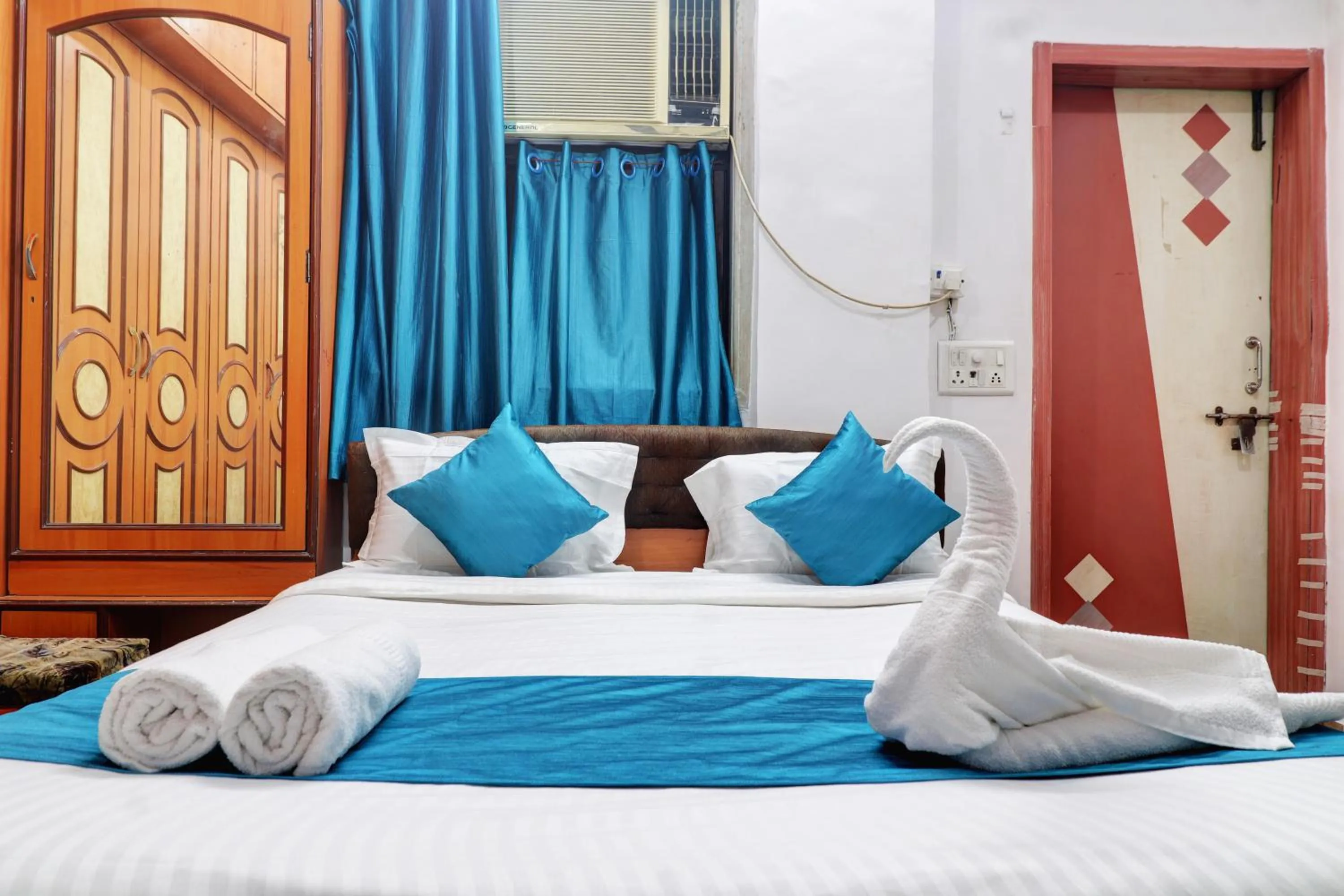 Bed in Raksha Residency