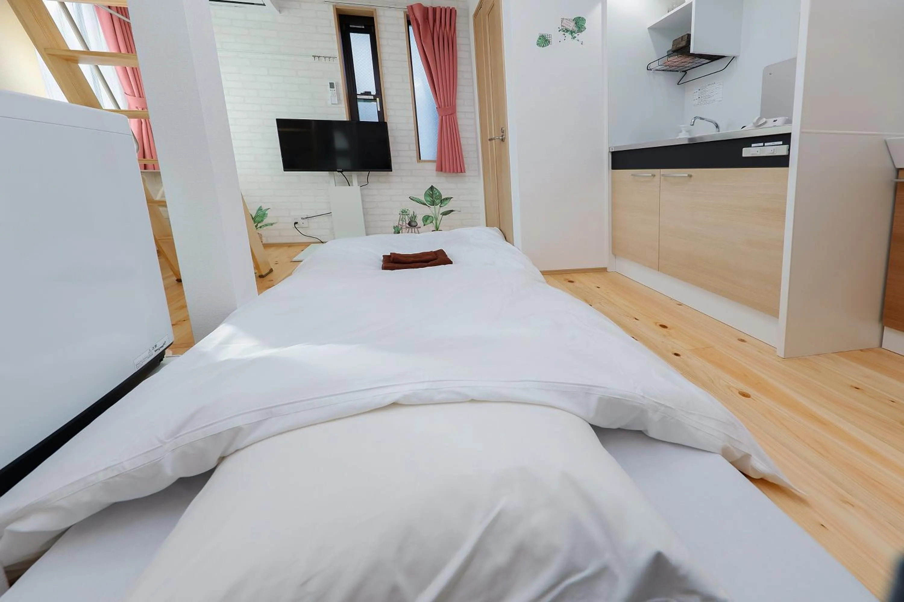 Bed in Zenith Shinjuku Hinoki by Tranova