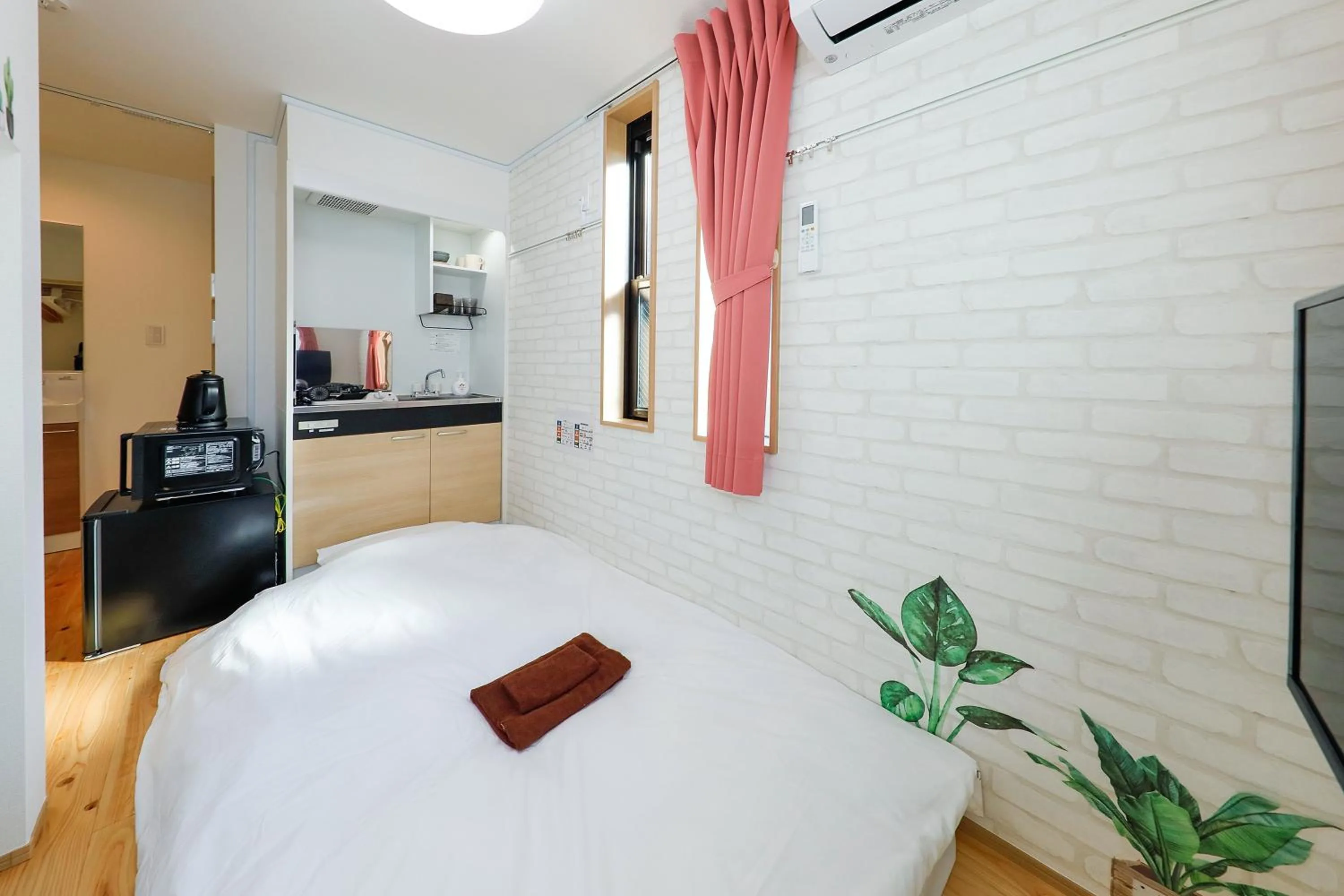 Bed in Zenith Shinjuku Hinoki by Tranova