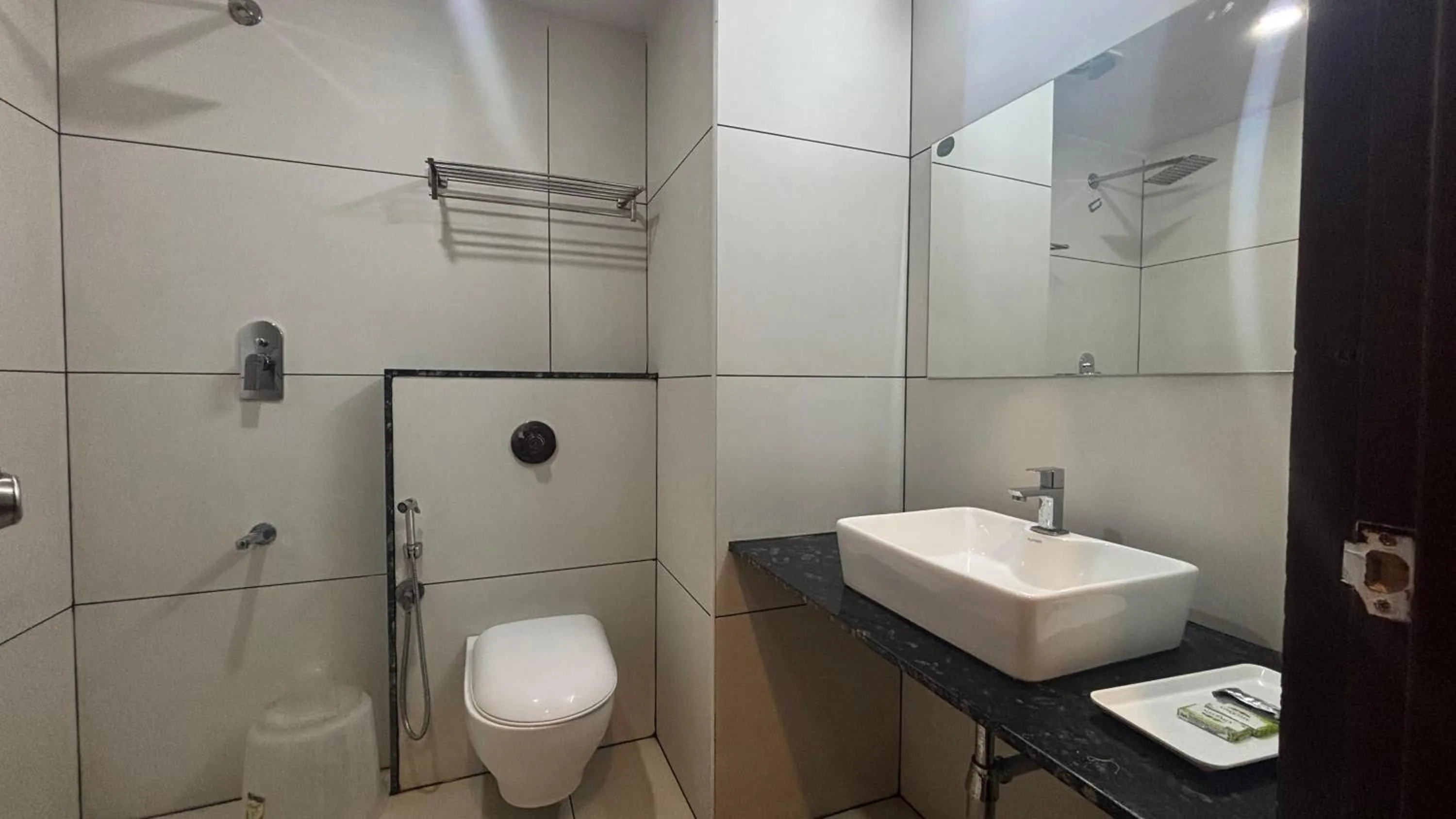 Shower in Hotel Kalyan Suites