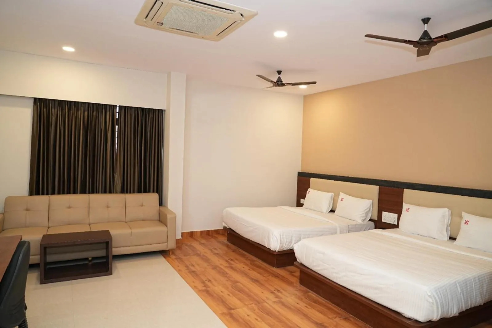 Bed in Hotel Kalyan Suites