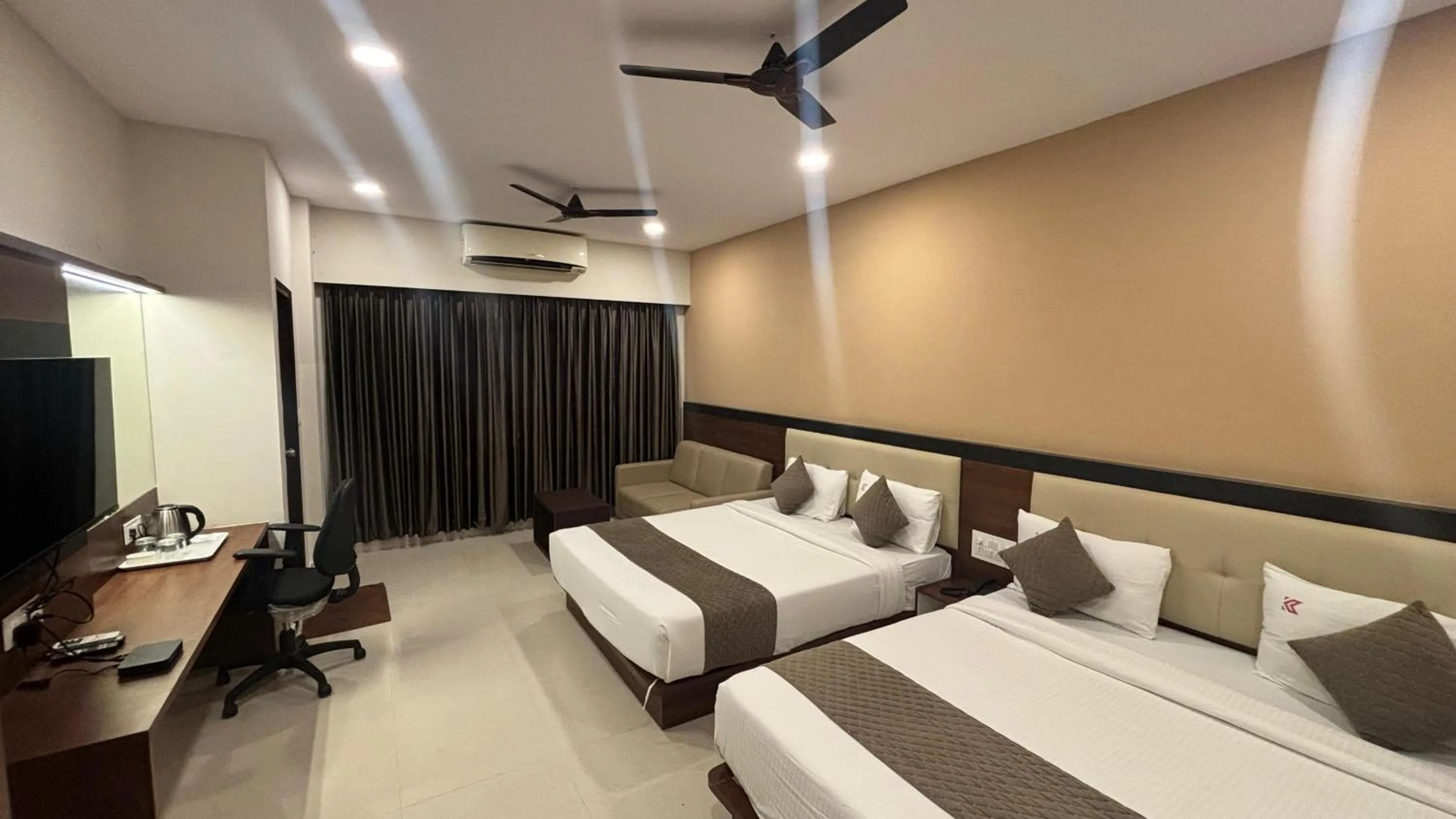 Bed in Hotel Kalyan Suites