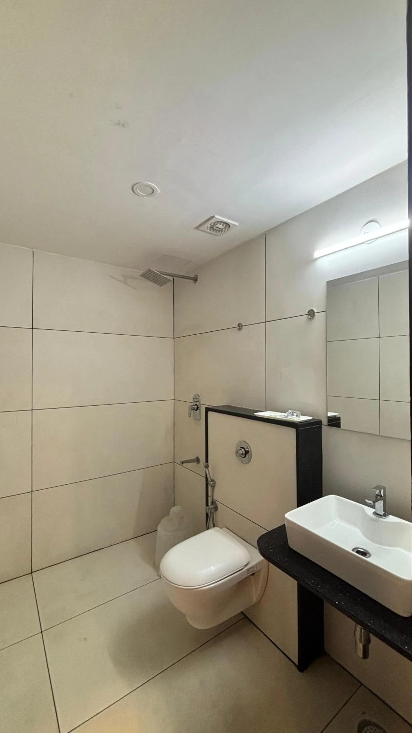 Shower in Hotel Kalyan Suites