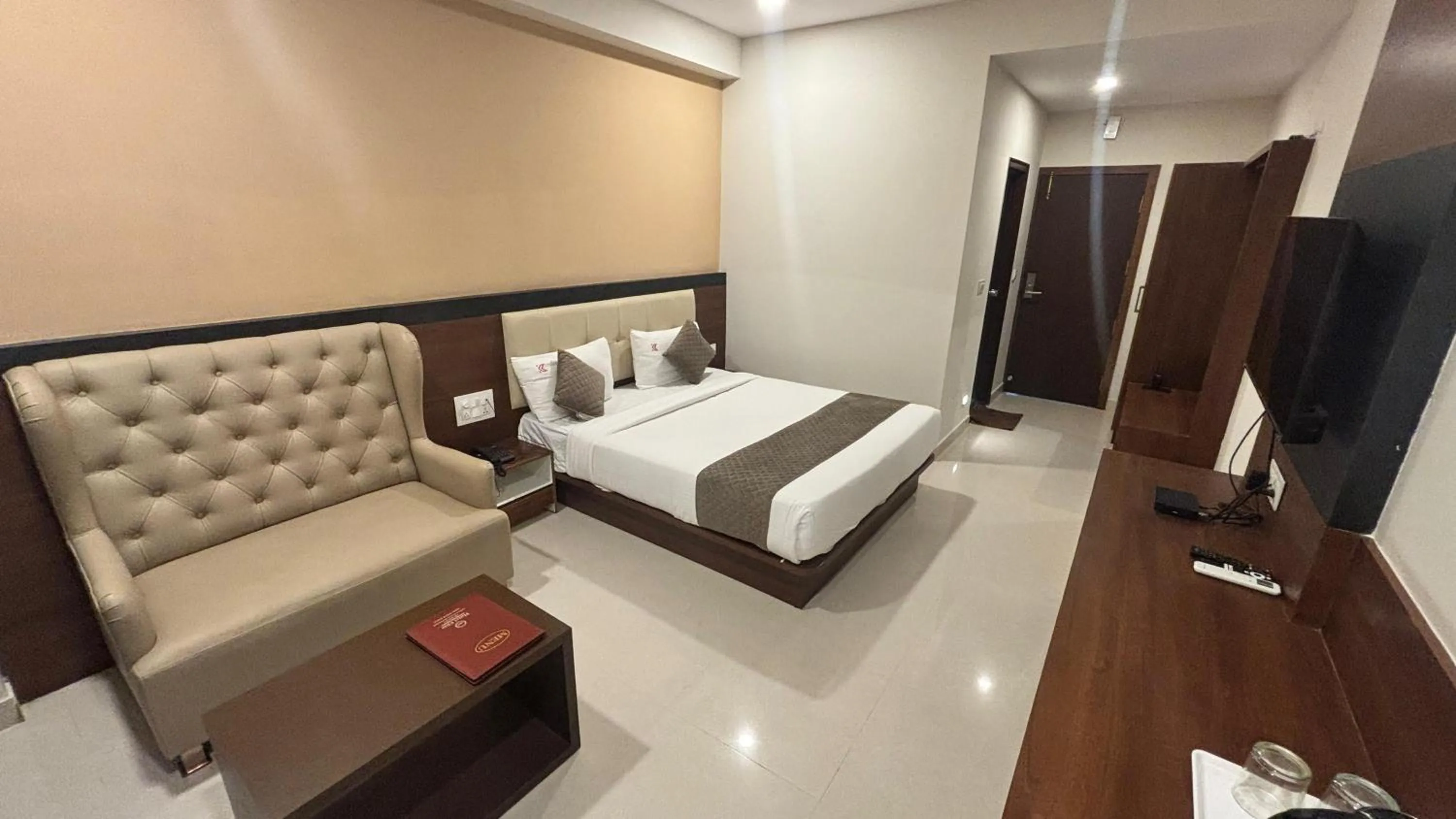Bed in Hotel Kalyan Suites