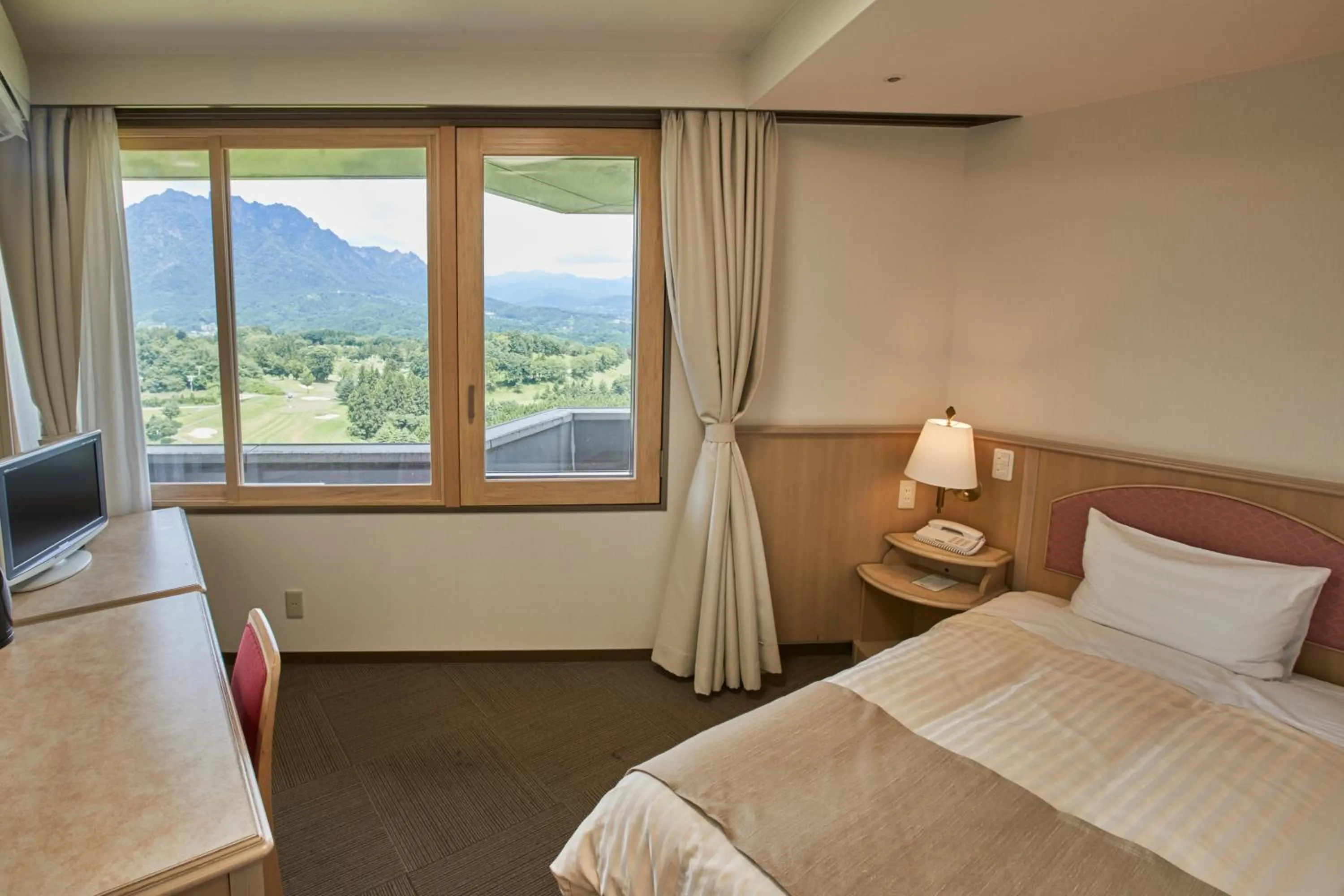 Bed in Myogi Green Hotel