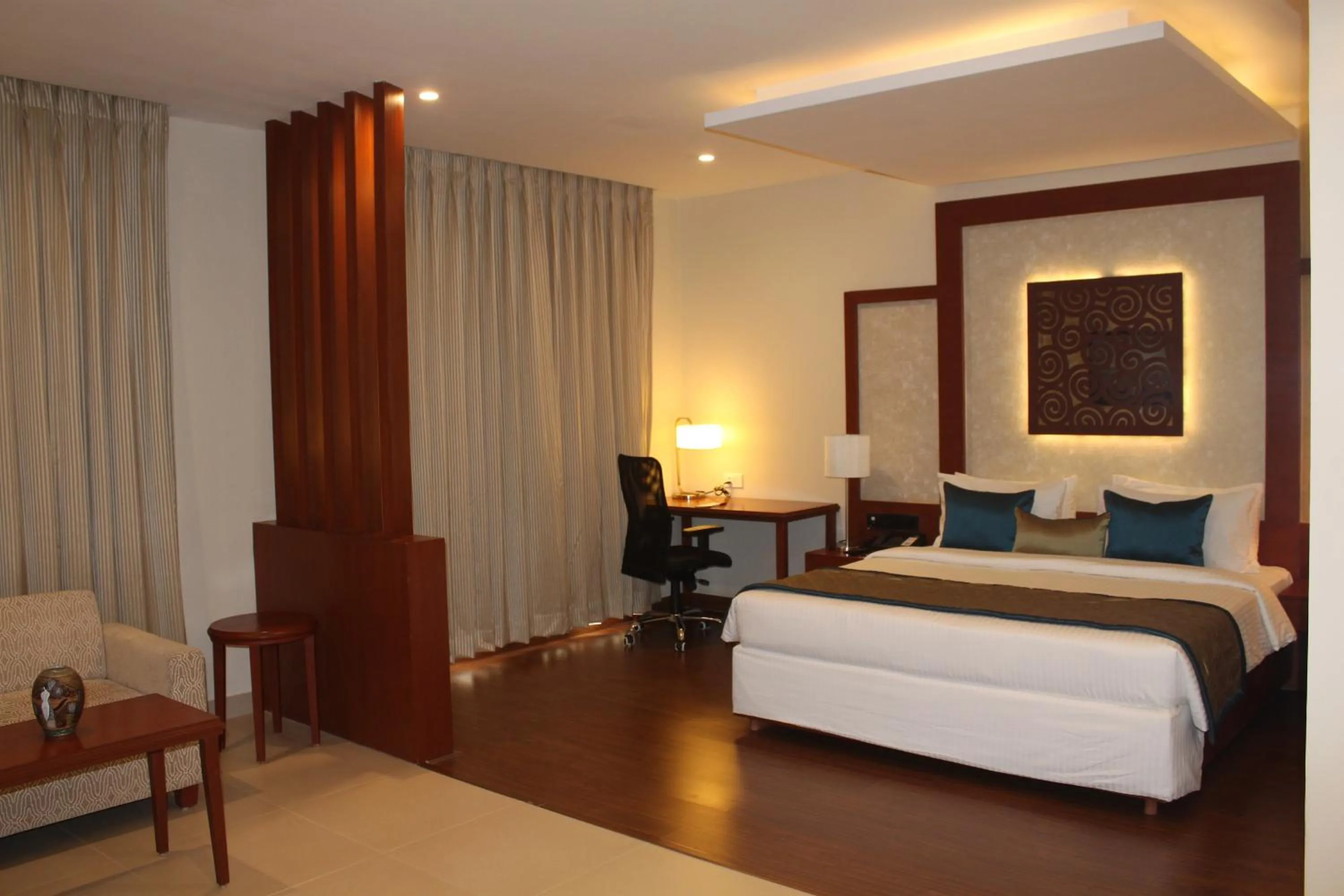 Seating area, Bed in The Altruist Business Hotel Hitech