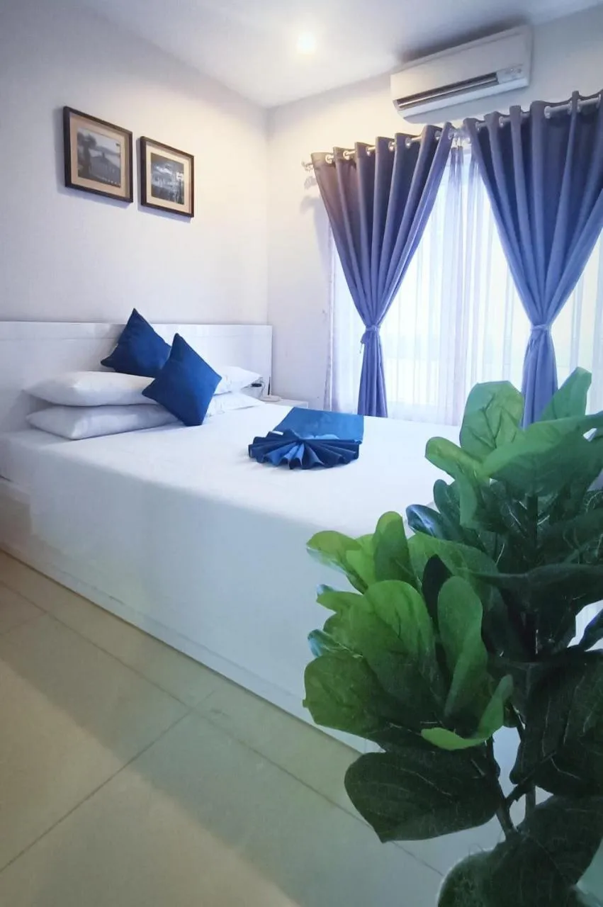 Bed in Queen Central Apartment Hotel