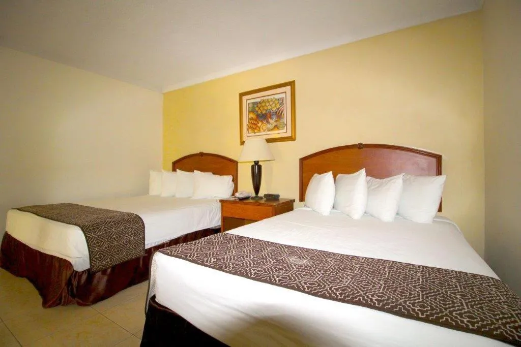 Bed in Hafersons Inn Hotel Suites