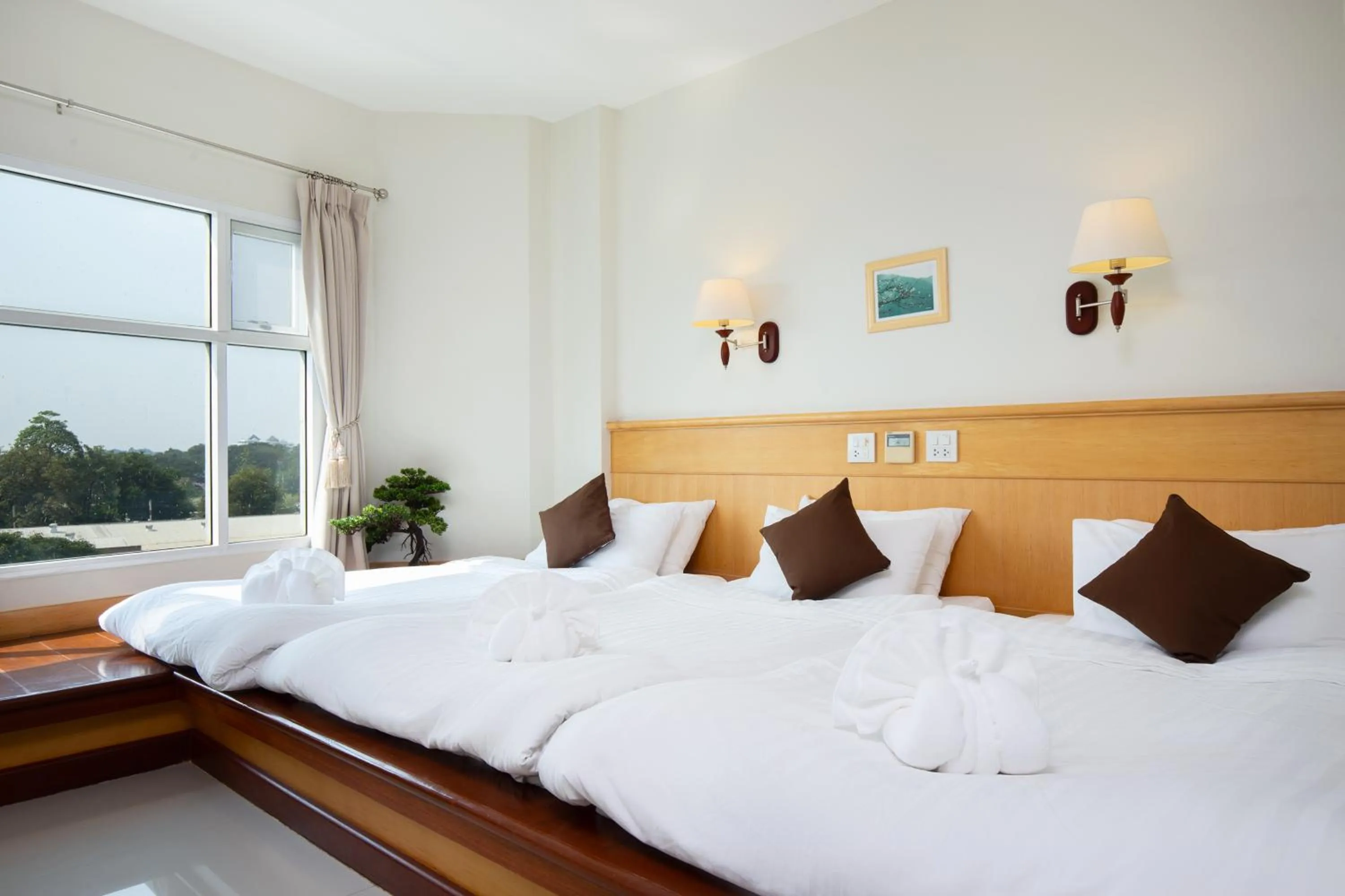 Bed in Kanchanaburi City Hotel