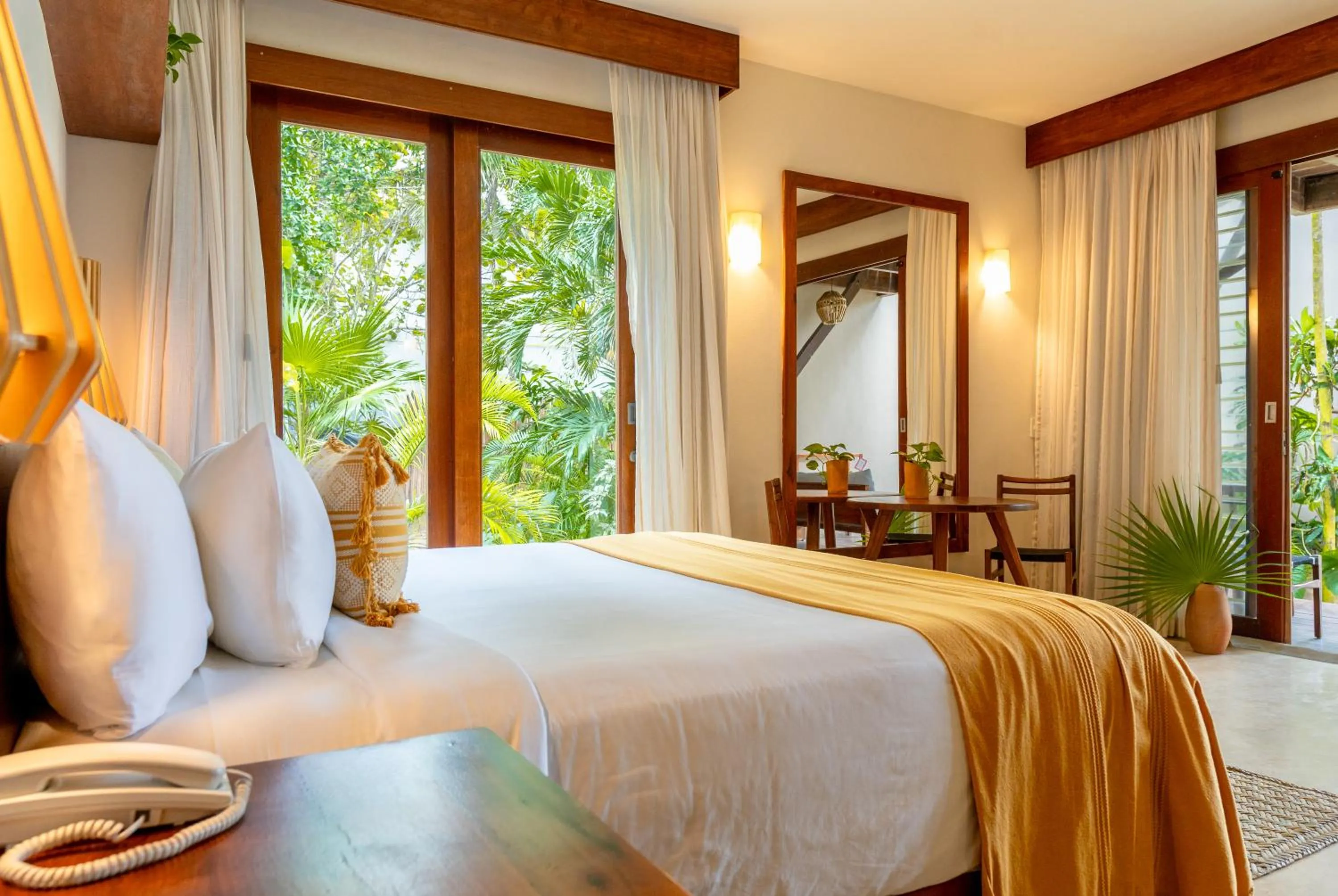 Bed in La Zebra Tulum, a Small Luxury Hotel