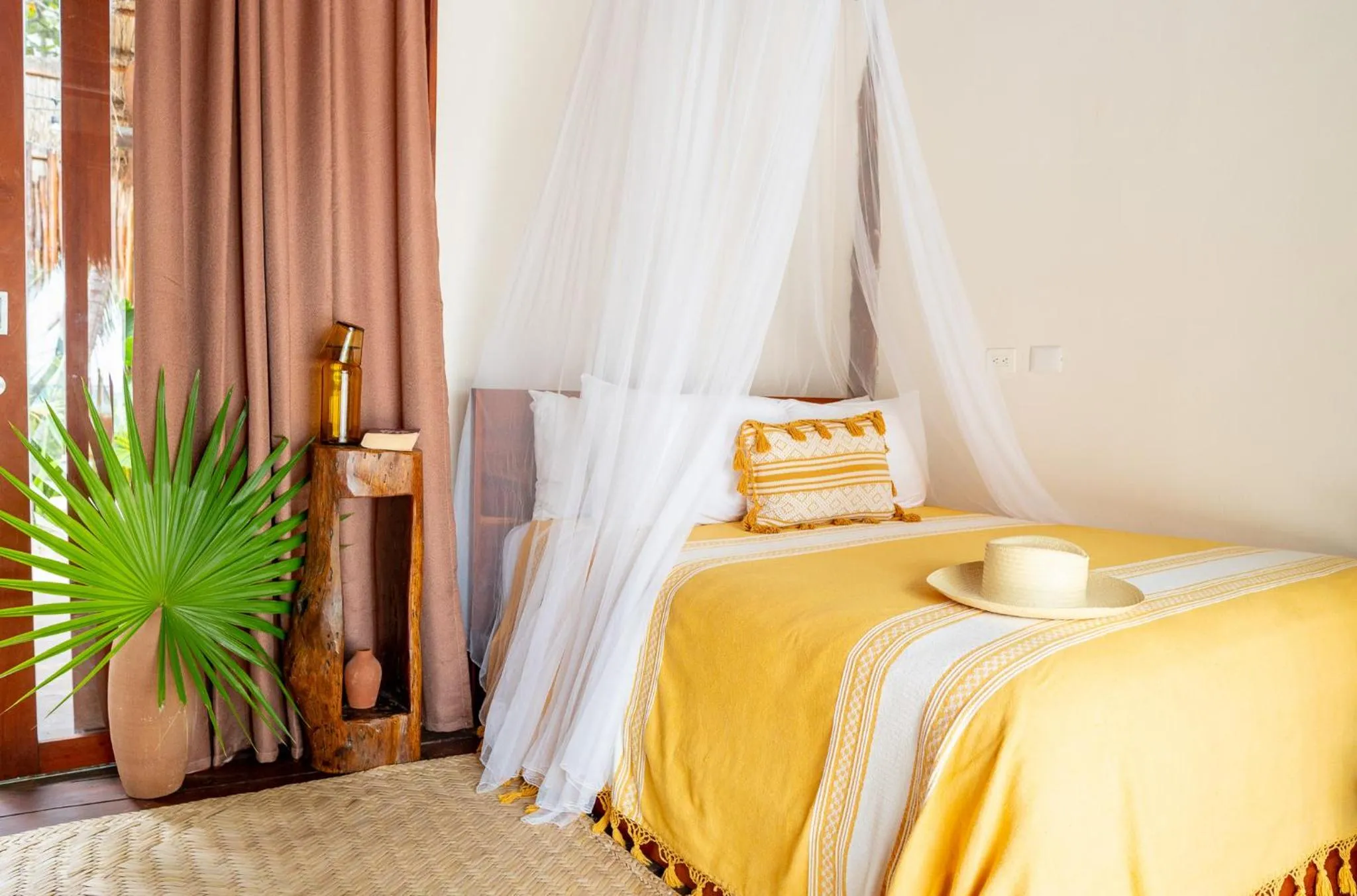 Bed in La Zebra Tulum, a Small Luxury Hotel