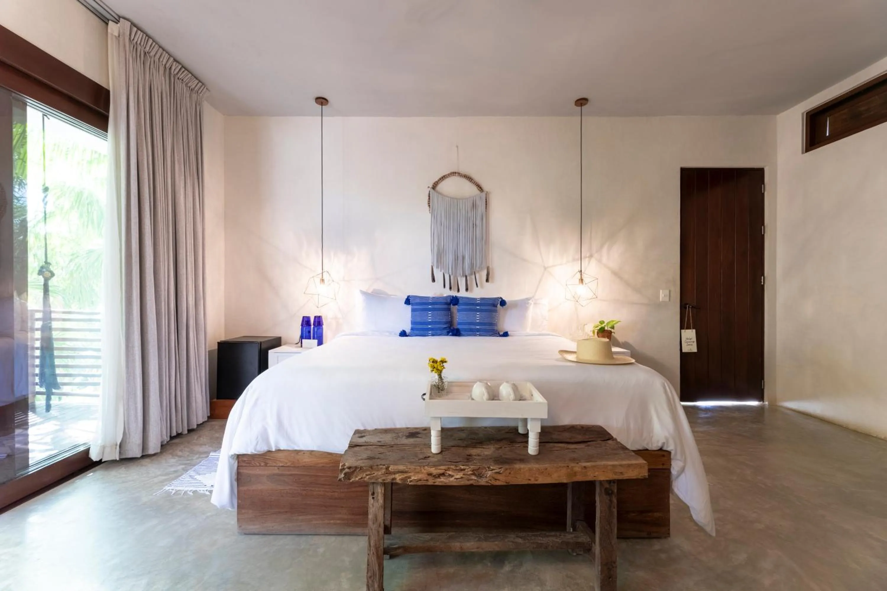 Bed in La Zebra Tulum, a Small Luxury Hotel