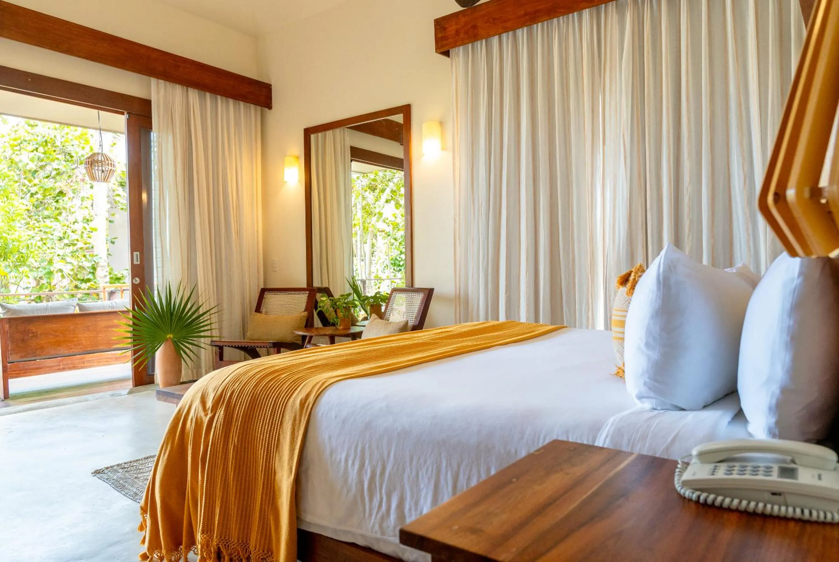 Bed in La Zebra Tulum, a Small Luxury Hotel
