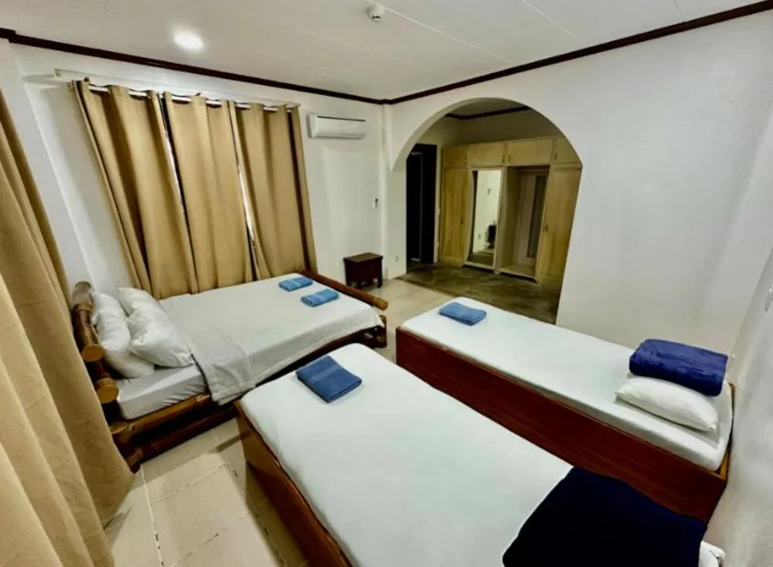 Bedroom, Bed in Bluewaves Hostel & Villa Panagsama by Hiverooms