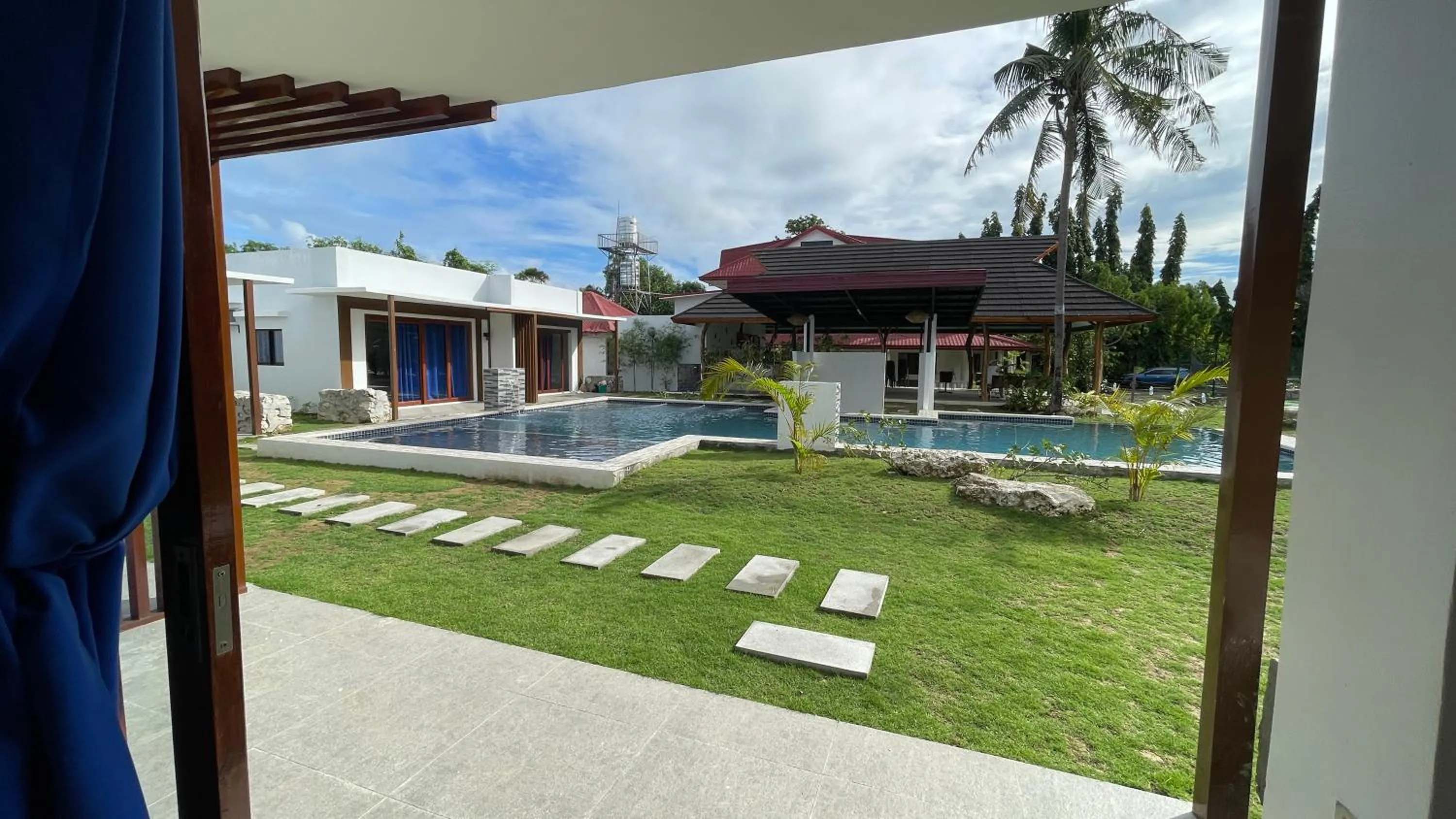 Property building in Bluewaves Hostel & Villa Panagsama by Hiverooms