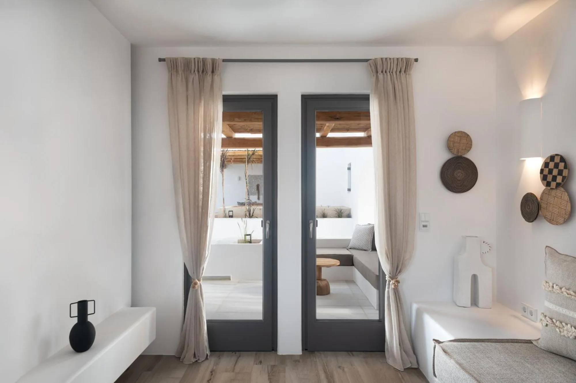 Seating area, Bed in Kosmitis Suites & Villas